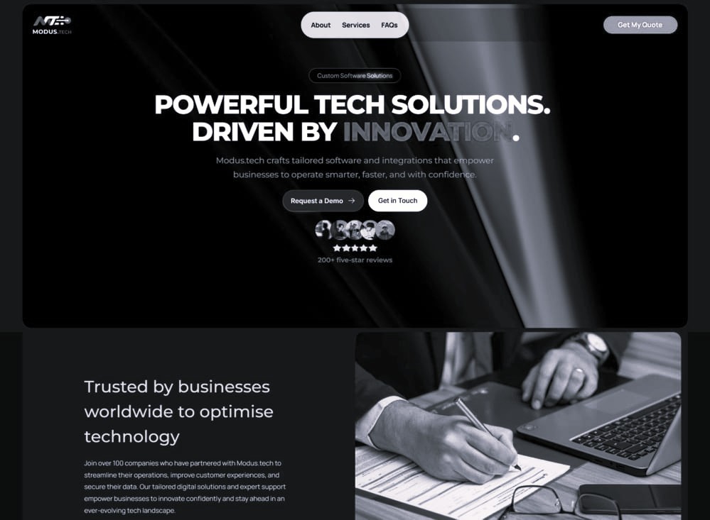 Website homepage for a modern technology website, displaying a prominent heading and rays of light above an image with a person using a laptop
