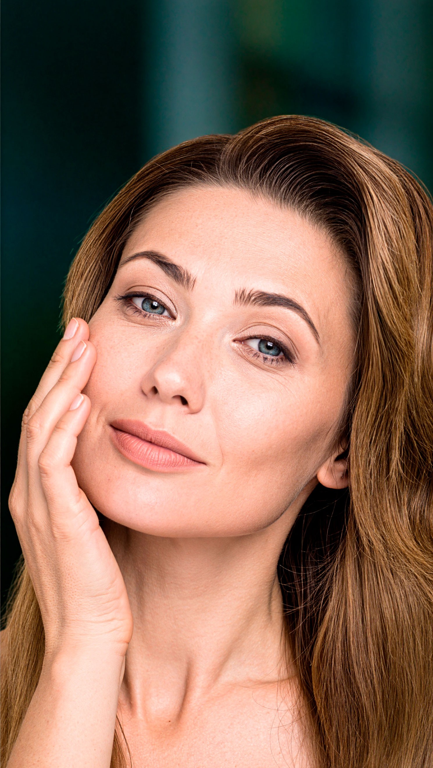 Rachel Stone, personal trainer and fitness coach, smiling in natural light