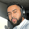 Man with headphones looking at camera.