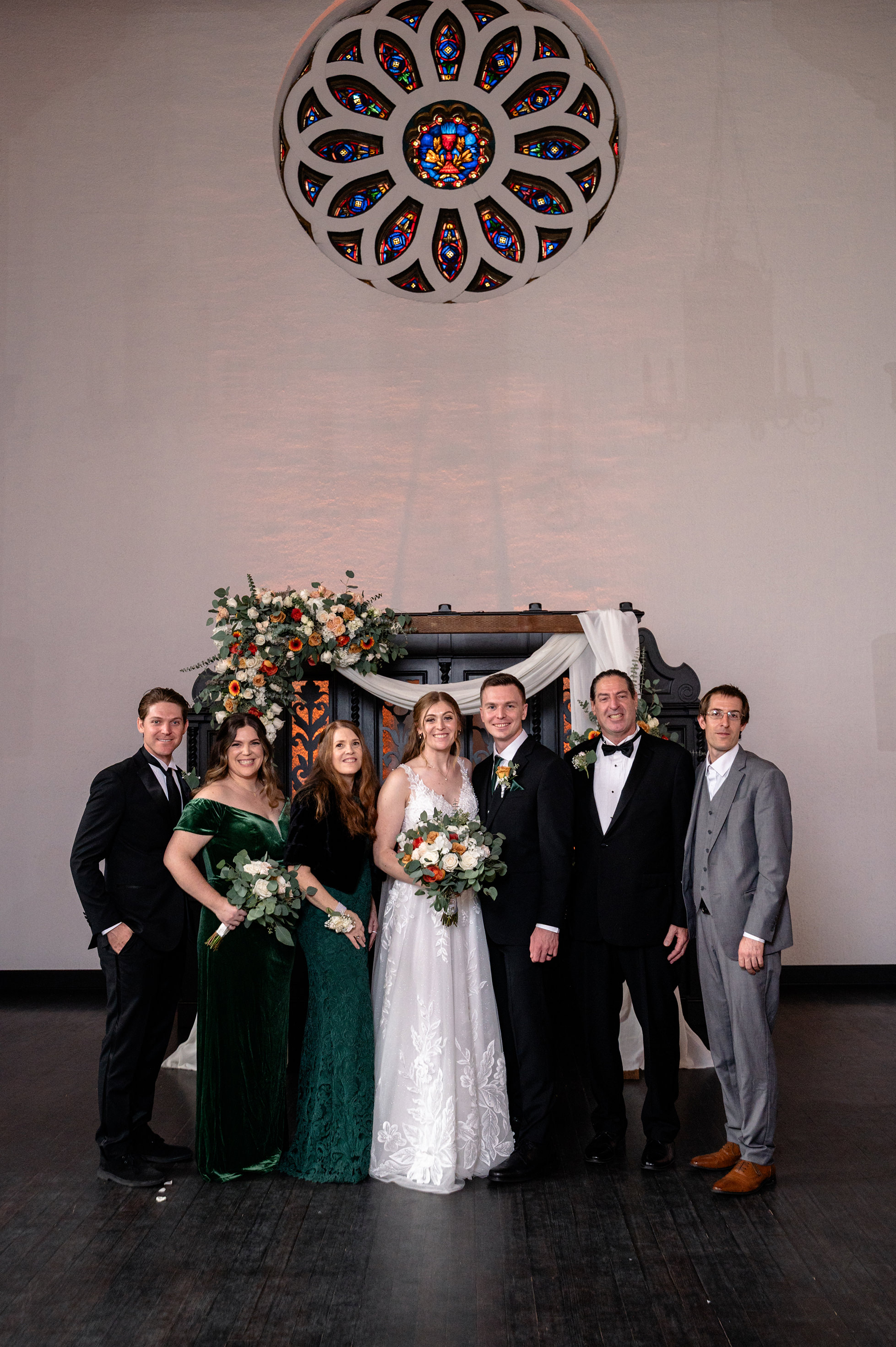 Flat lay wedding details with bouquet, rings, and sparkling bridal heels