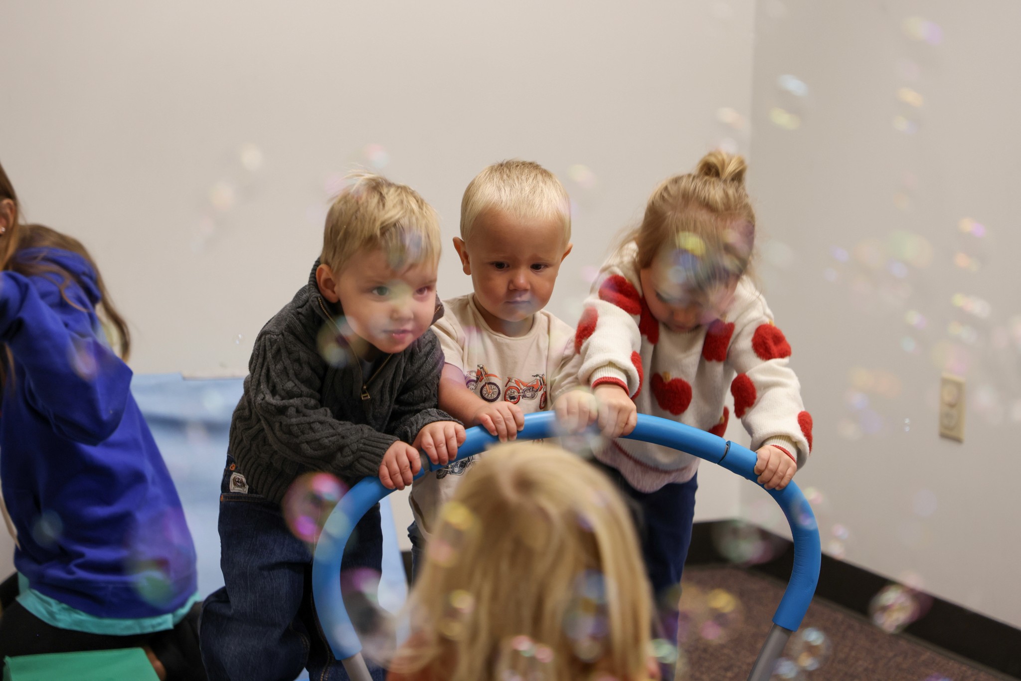 two people looking at a tablet and smiling