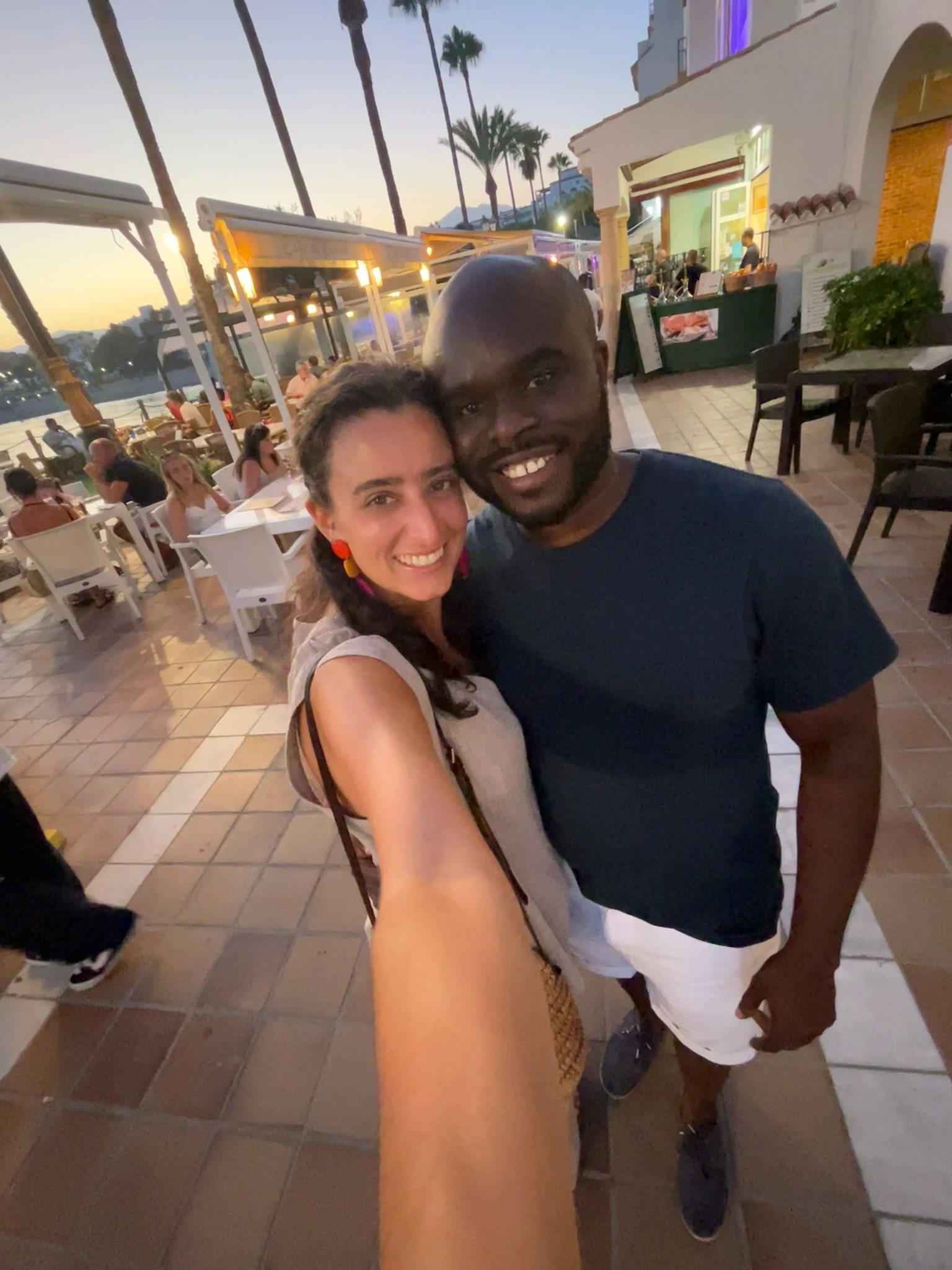 Two gold wedding rings rest atop a soft, textured fabric with a subtle pattern. The rings shine under gentle light, evoking themes of love and commitment.