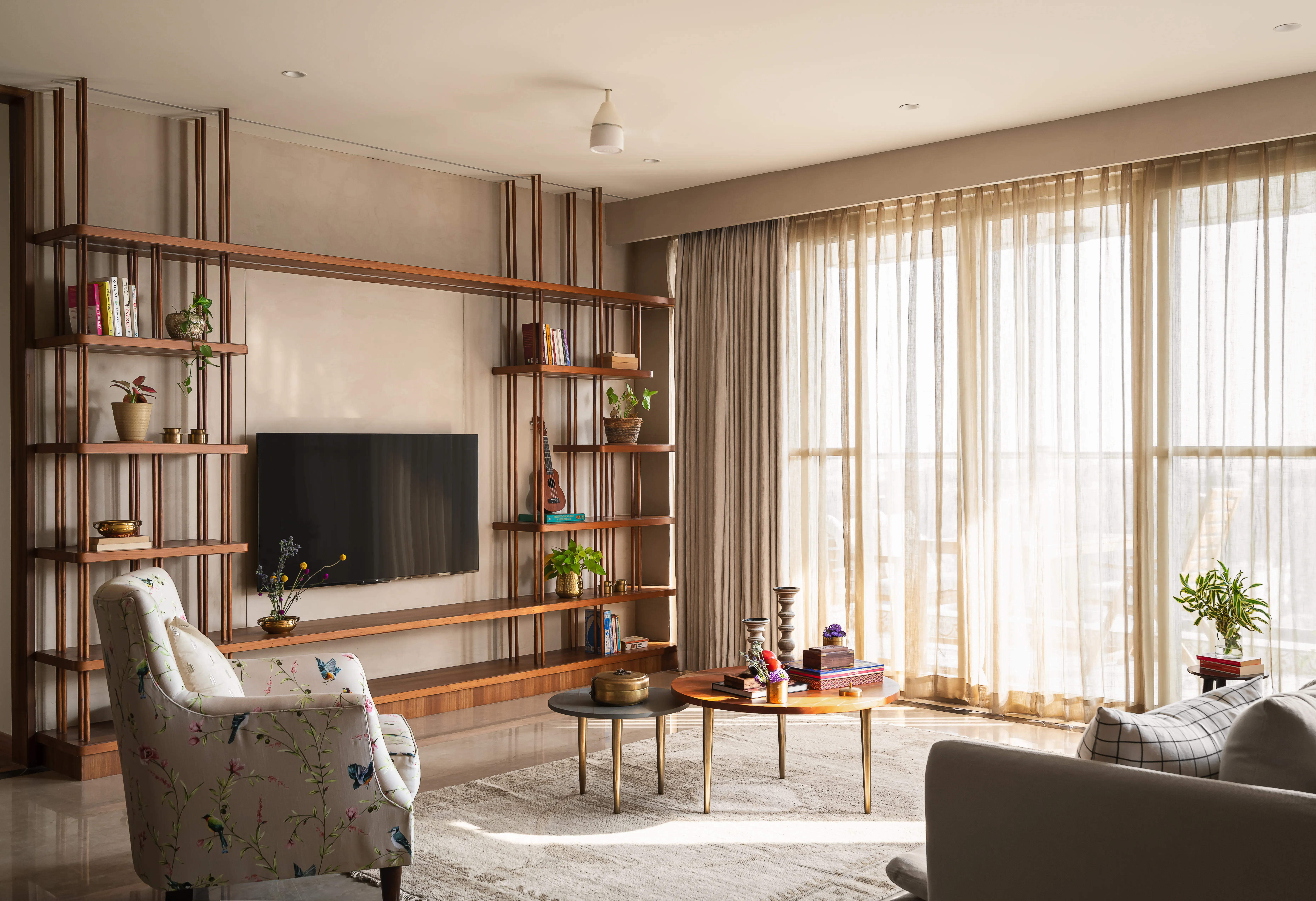 a living room filled with furniture and a large window