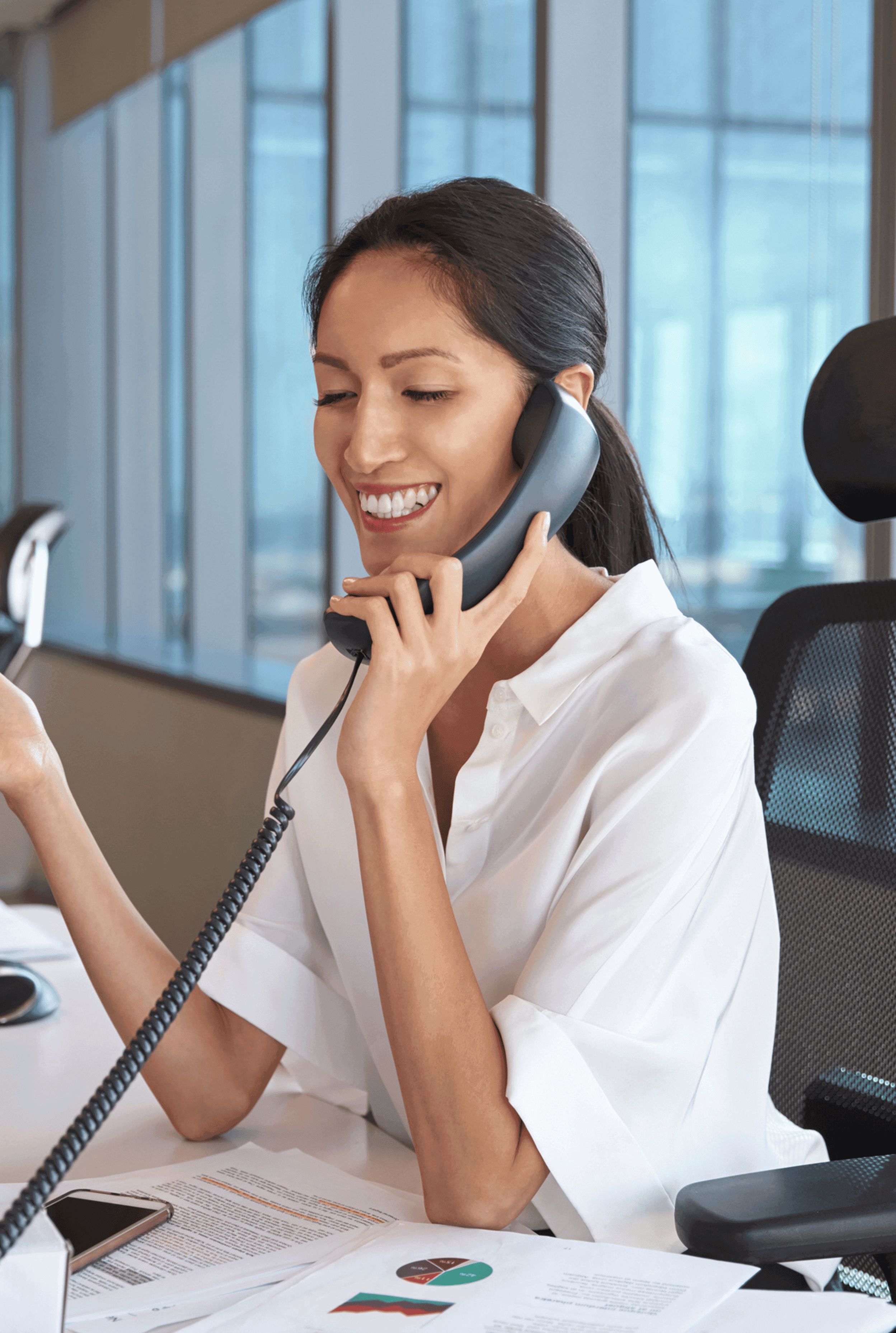 Mount fuji viewed across a lake with red bushes.