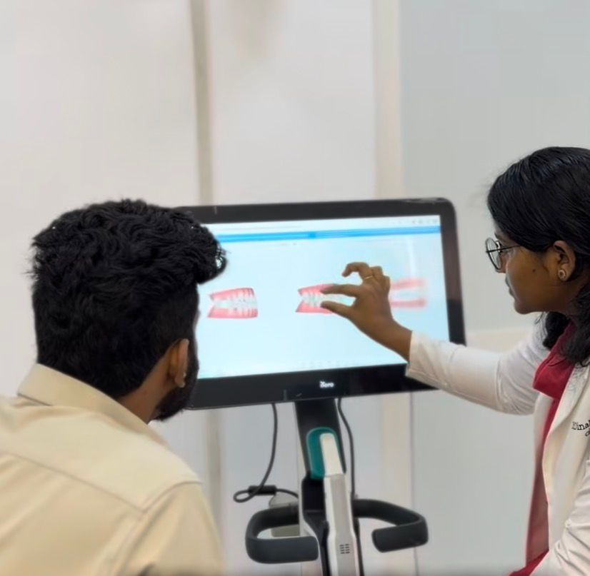 Healthcare professional in blue scrubs discussing treatment with older patient using tablet in medical office