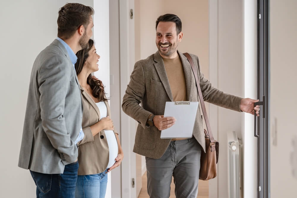 Man showing couple an apartment