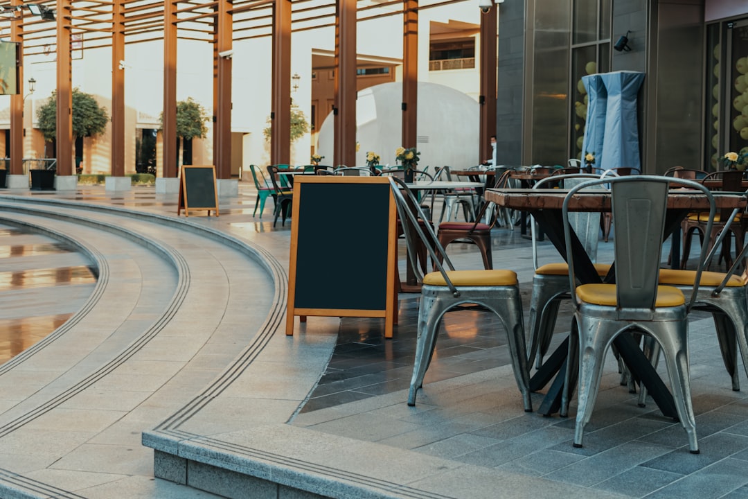 A table and chairs sitting outside of a building