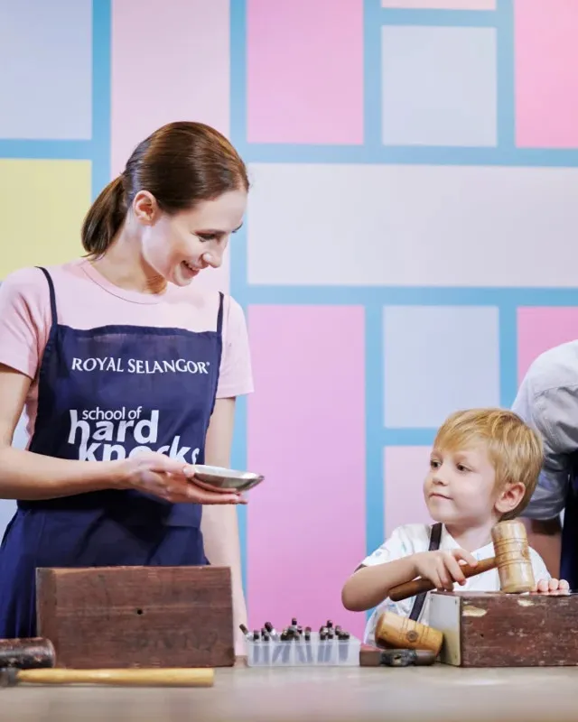 Young girl with backpack walks on dirt path