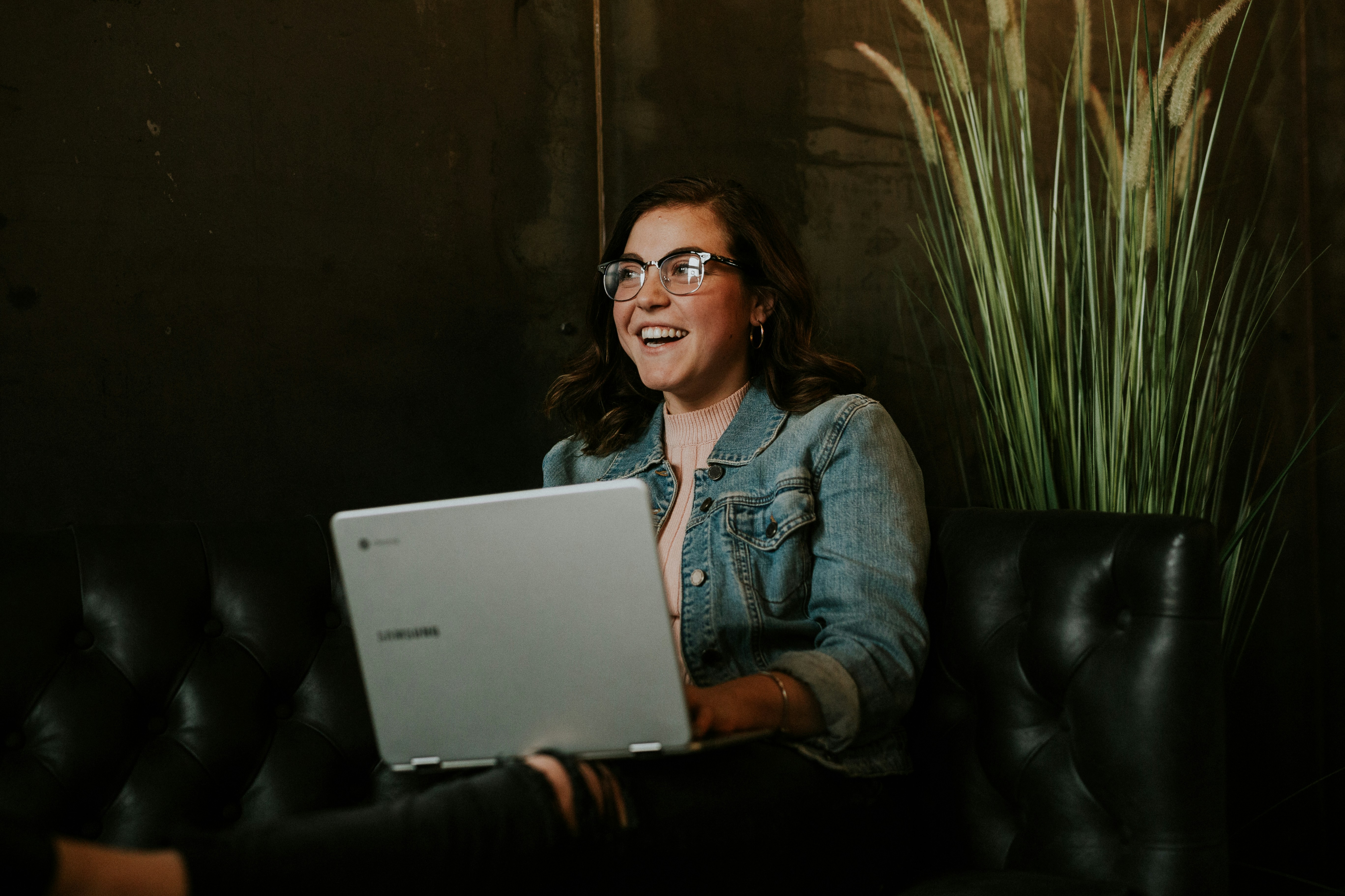 woman smiling at results from youtube shorts SEO