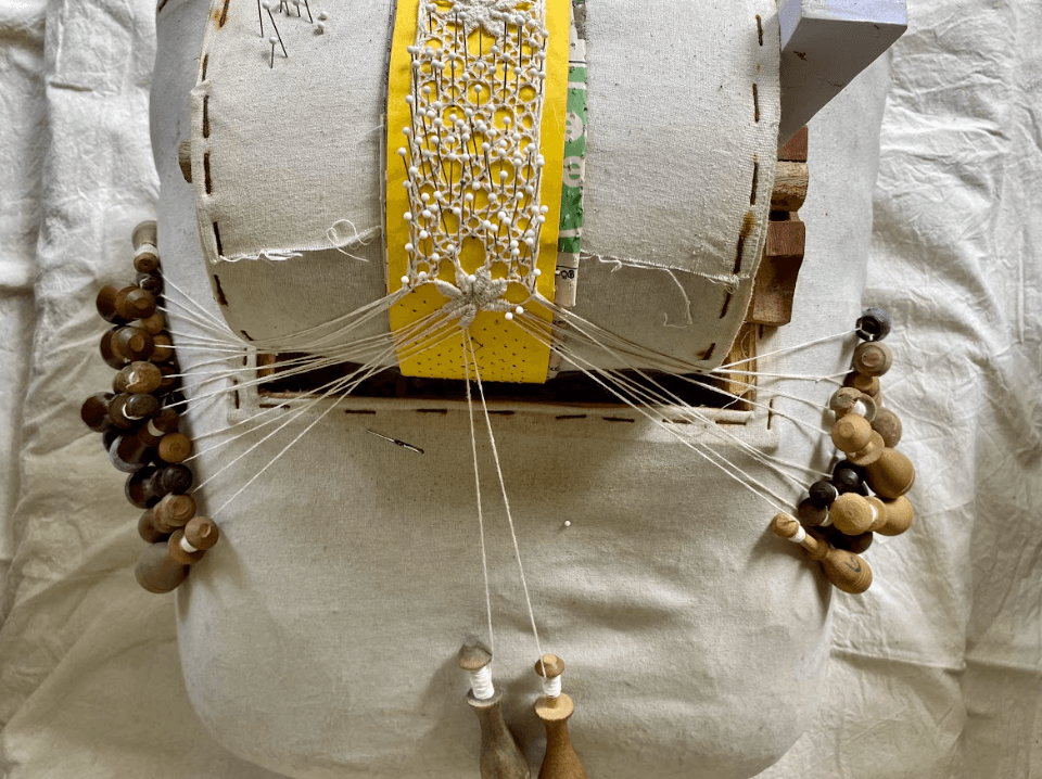 a group of women standing on top of a sandy beach