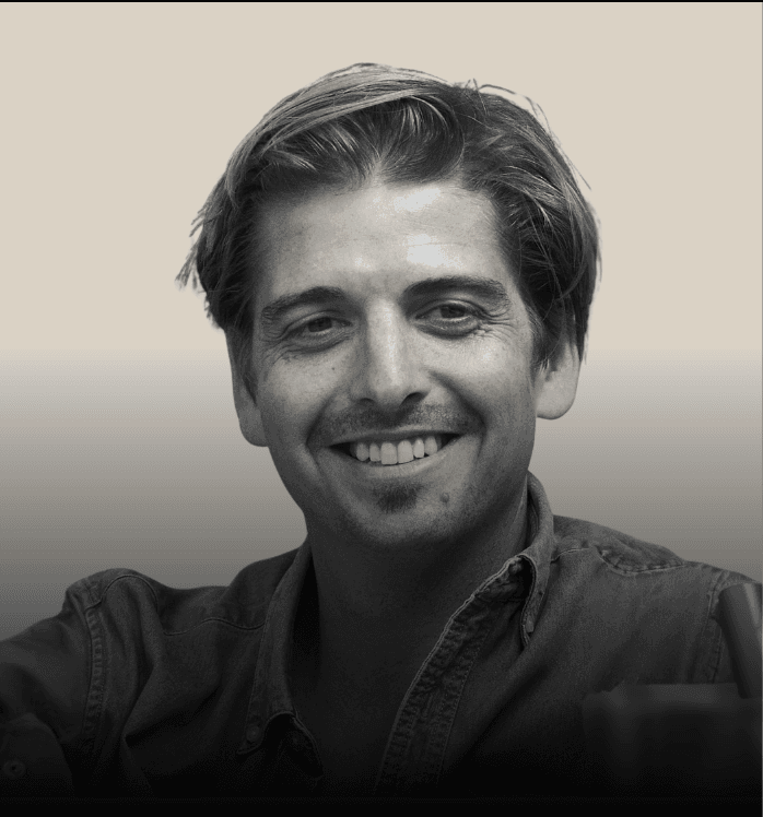 headshot of male in dark background