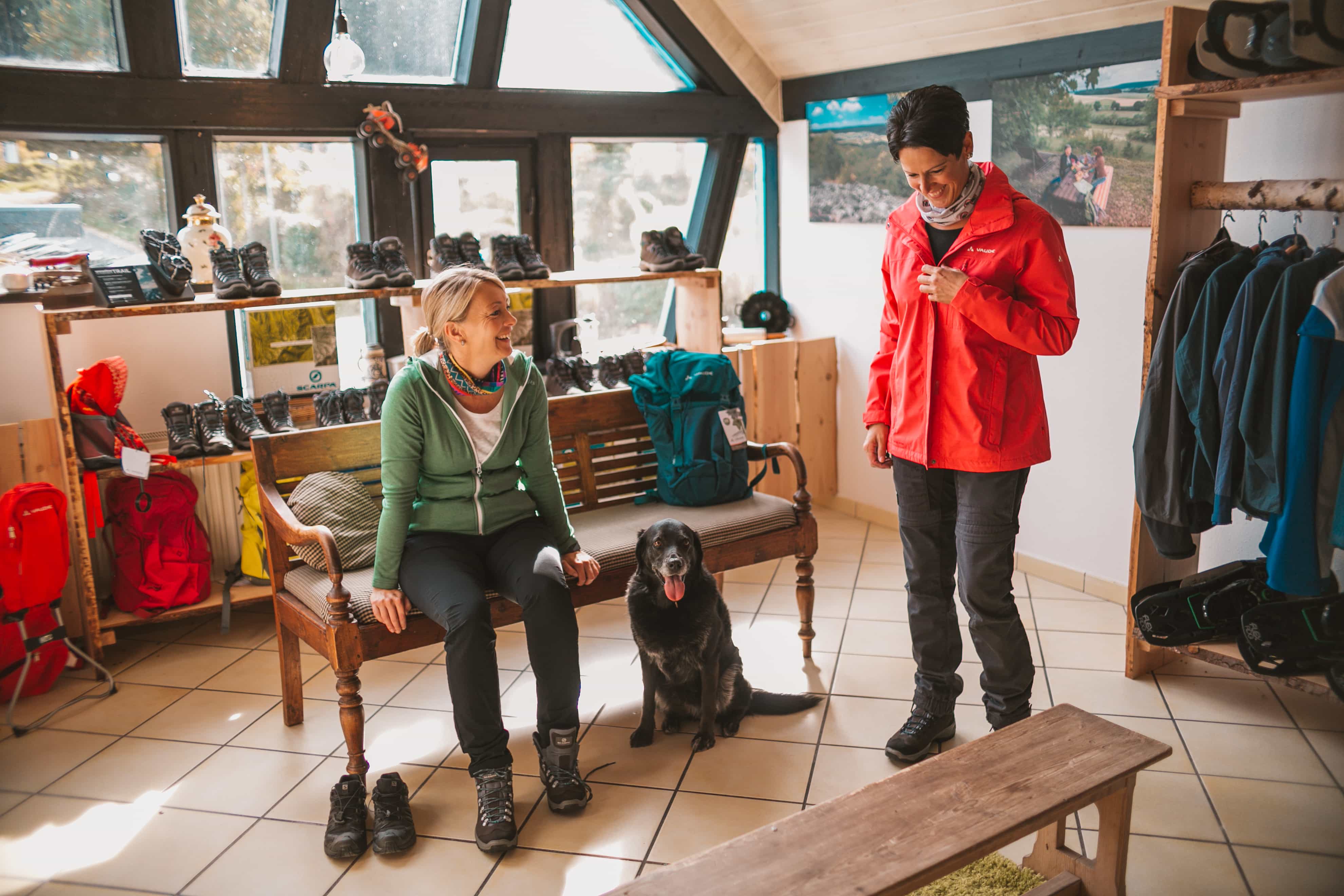 Two women with a dog in the test center