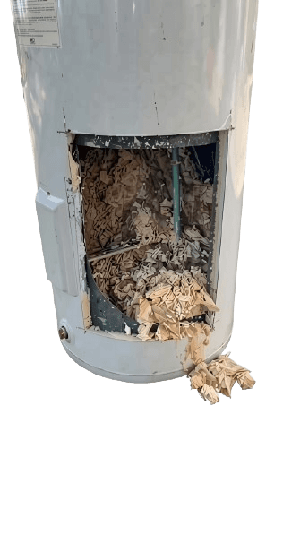 Damaged electric water heater showing sediment buildup