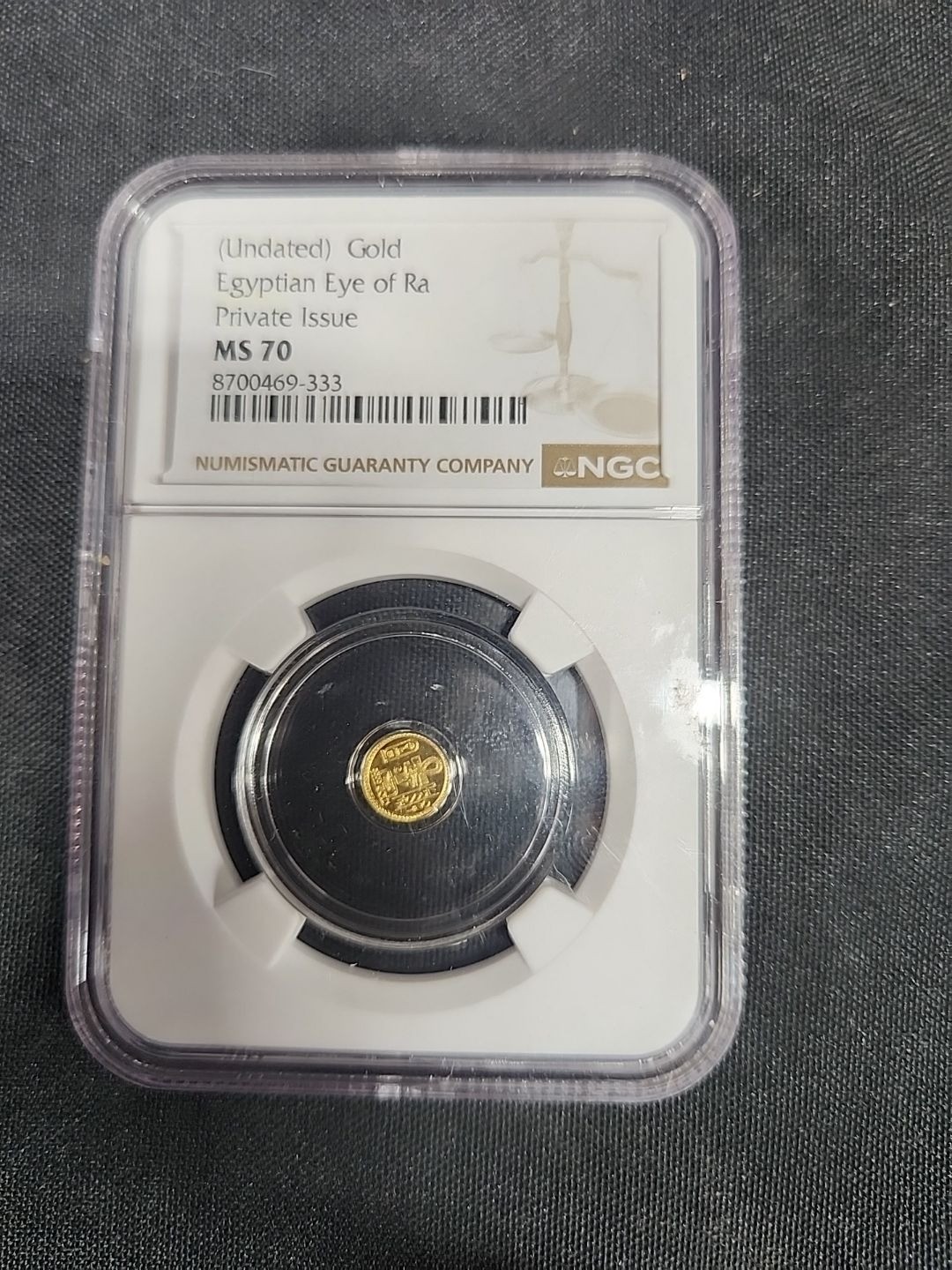 Lot 18: NGC Graded MS 70 Gold Egyptian Eye of Ra gold coin