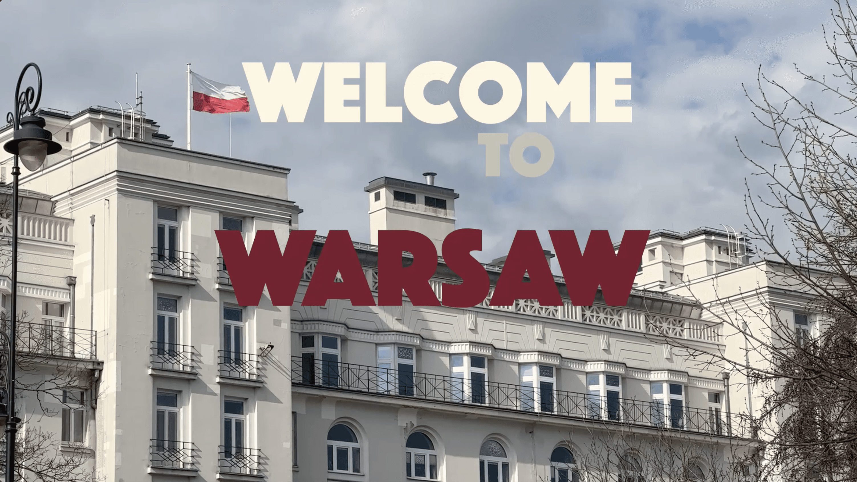 "Welcome to Warsaw" video cover with a Polish flag waving above a classic city building.