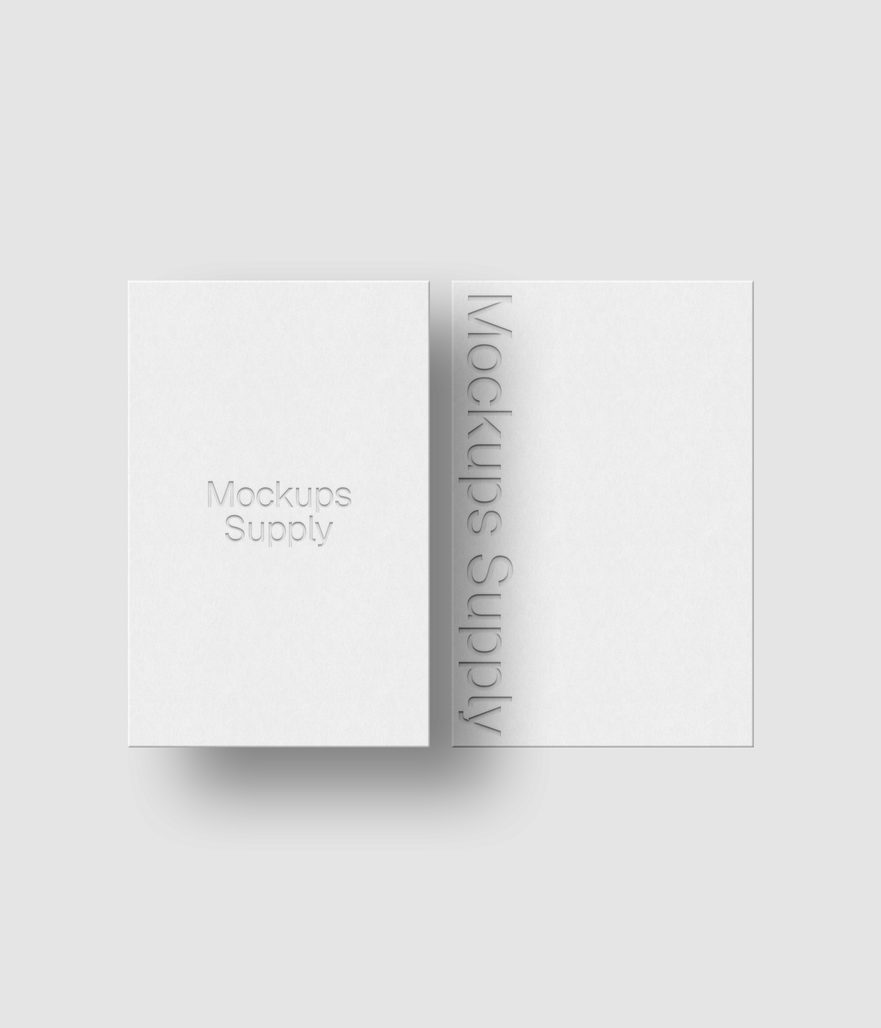 2 European business cards mockup for Photoshop with shadow and debossed text effect, white cards on white background, minimal branding and stationery presentation