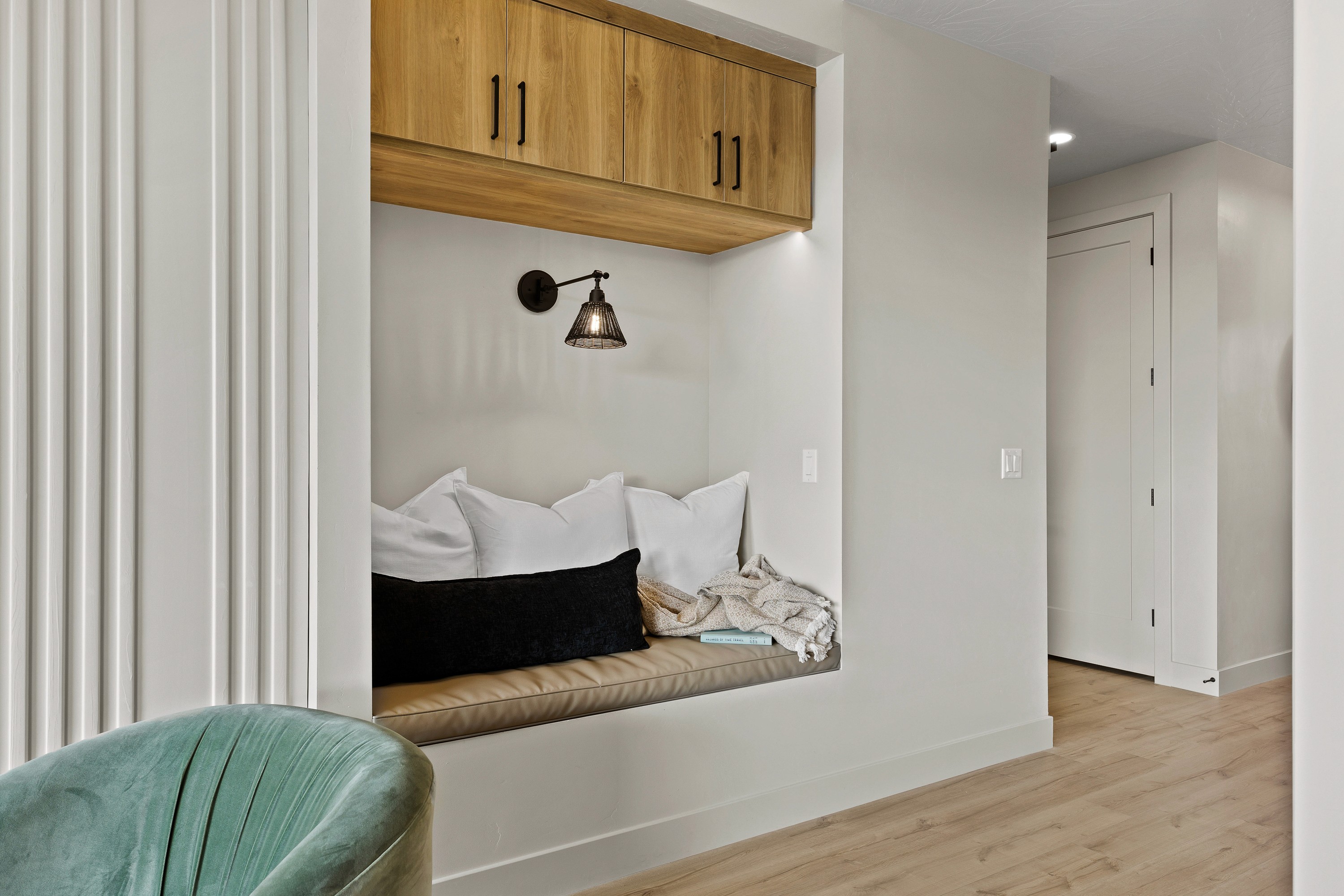 Built-in reading bench in the great room of the BYSO House in Hurricane, Utah providing a cozy nook.
