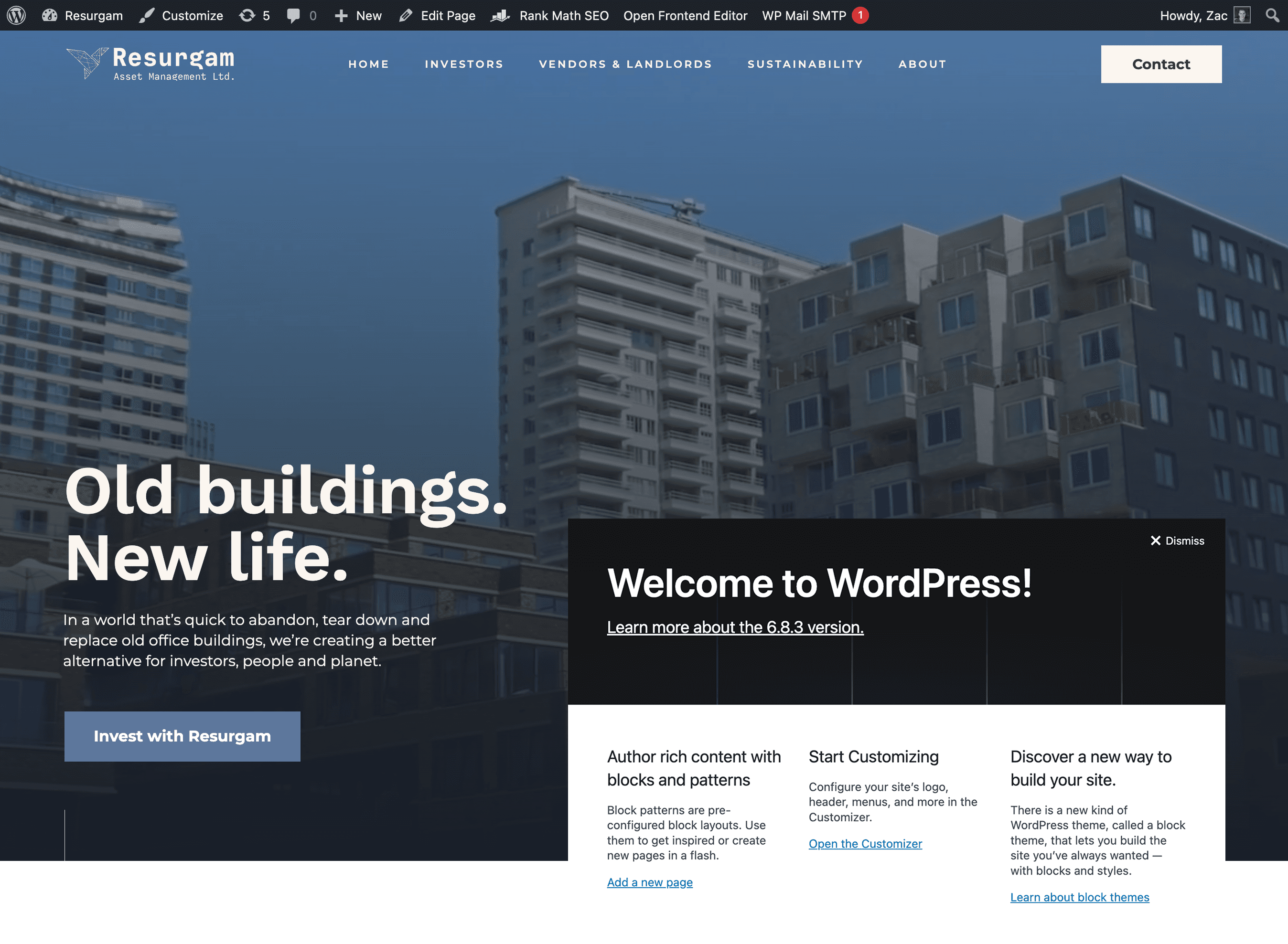 A screenshot of a WordPress website in development for a company named 'Resurgam' with the tagline 'Old buildings. New life.' The site features an image of modern and older apartment buildings, and an overlay box displays the 'Welcome to WordPress!' message, suggesting the site is newly created or being set up.