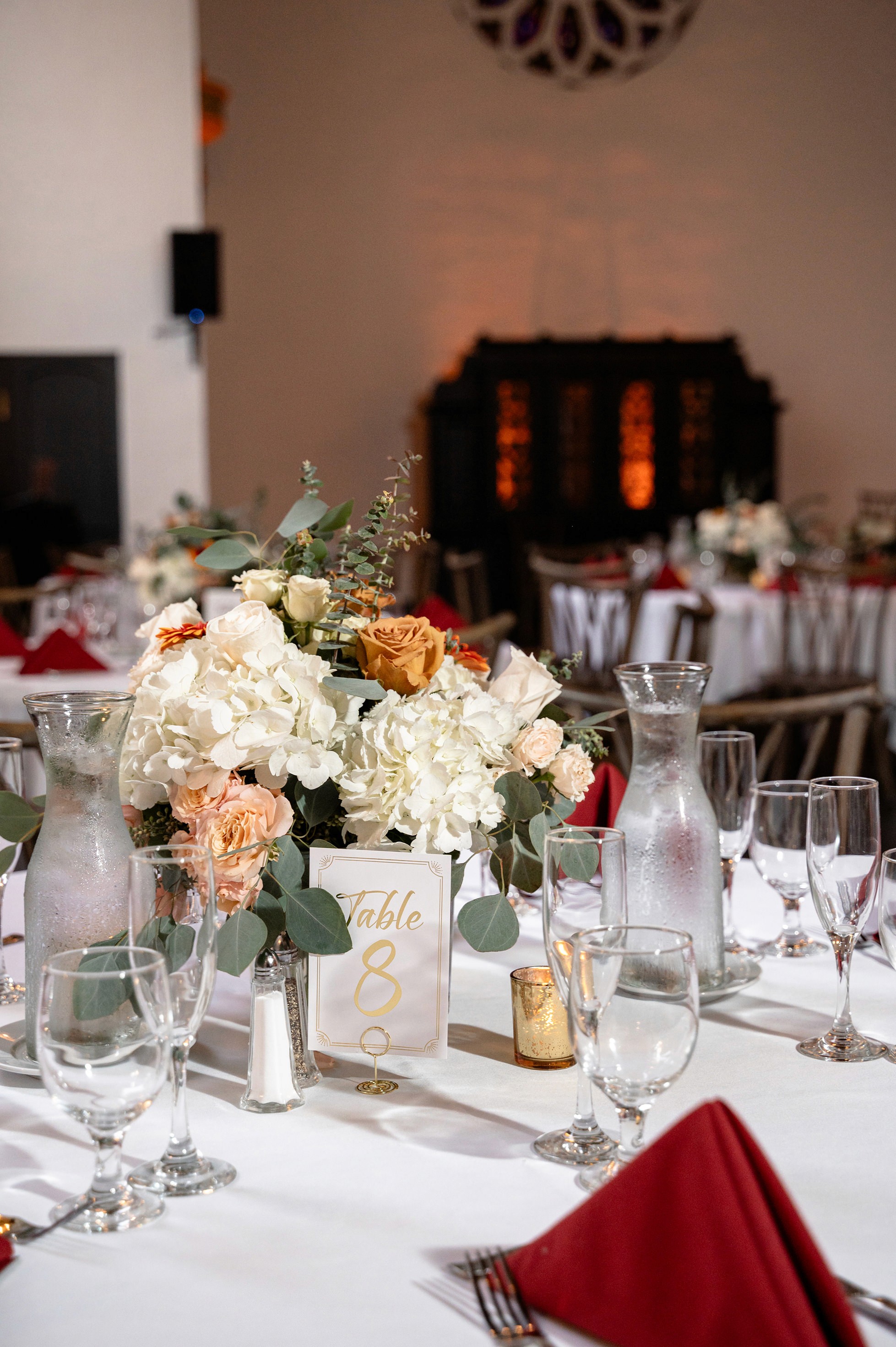 Flat lay wedding details with bouquet, rings, and sparkling bridal heels