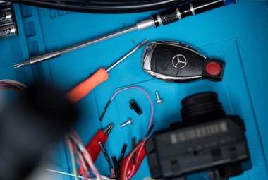 Automotive locksmith tools and car key components prepared for on-site car key replacement.