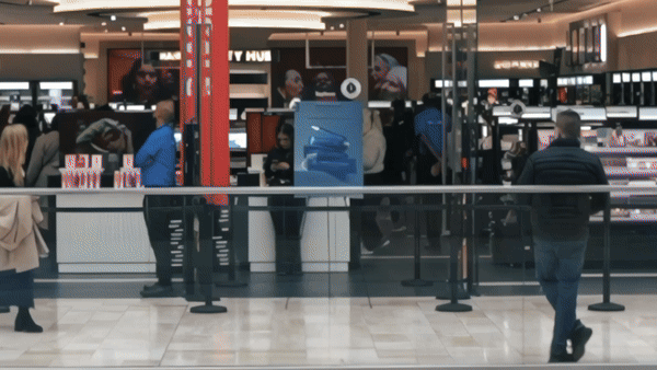Bride in white dress walking on street, blurred motorcycle passing