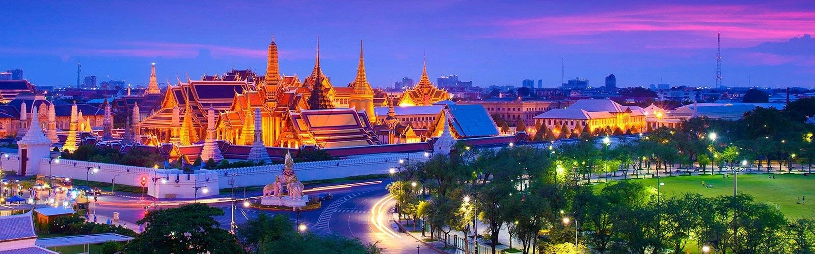 Illuminated temple complex at night.