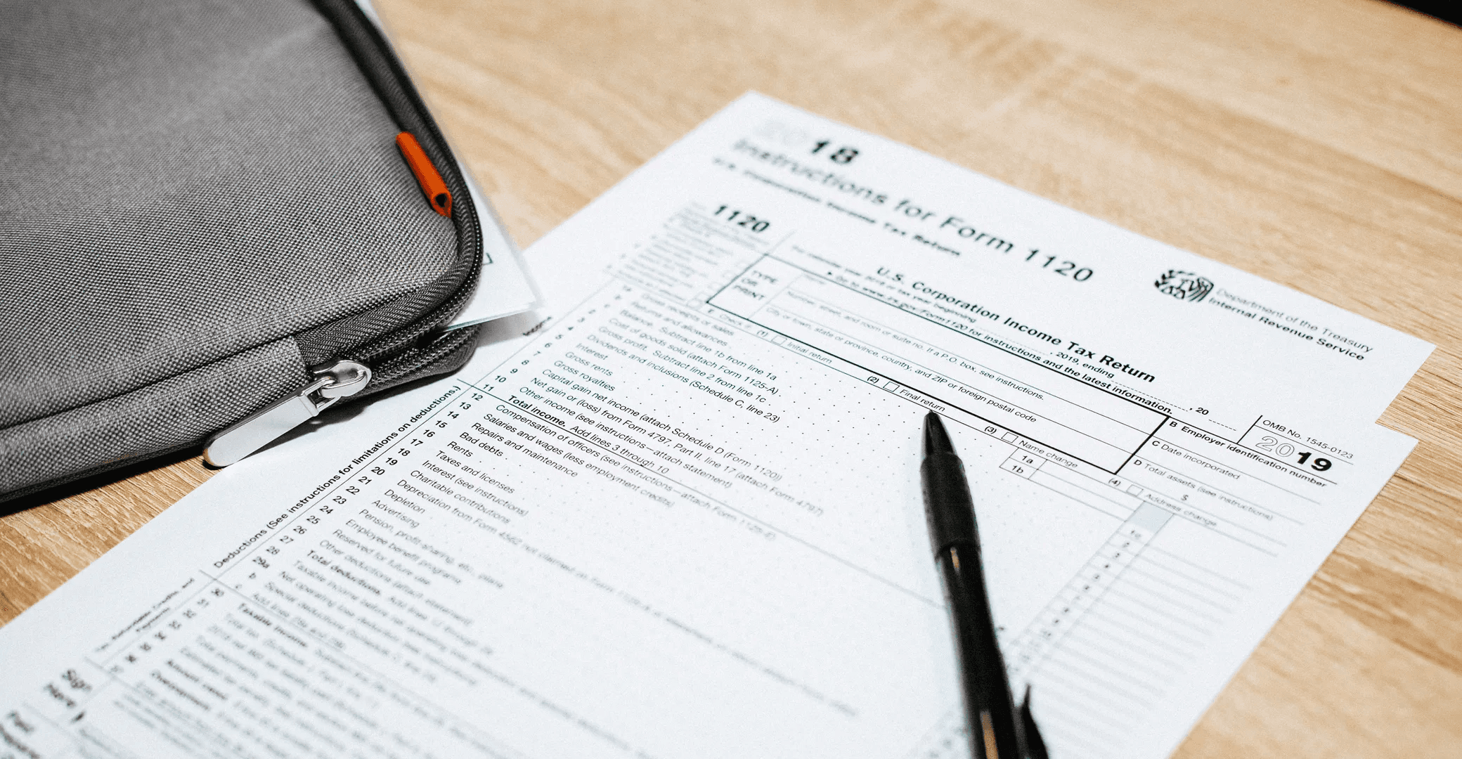 Corporate tax forms resting on desk - Close Corporation Taxation