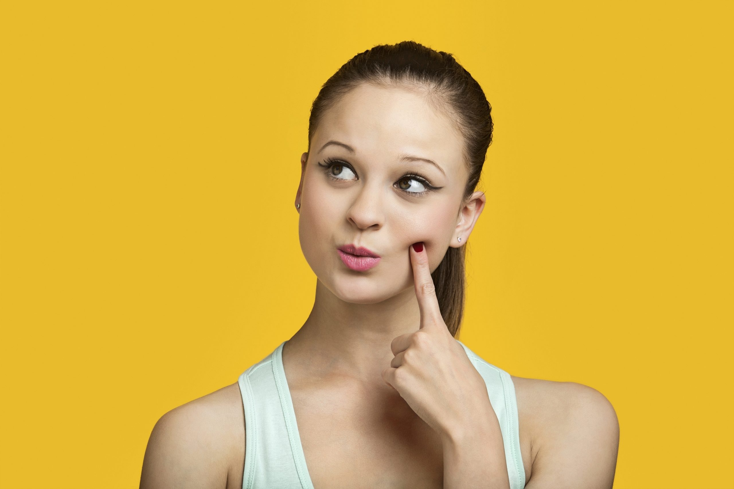 Man biting nails, looks worried or anxious
