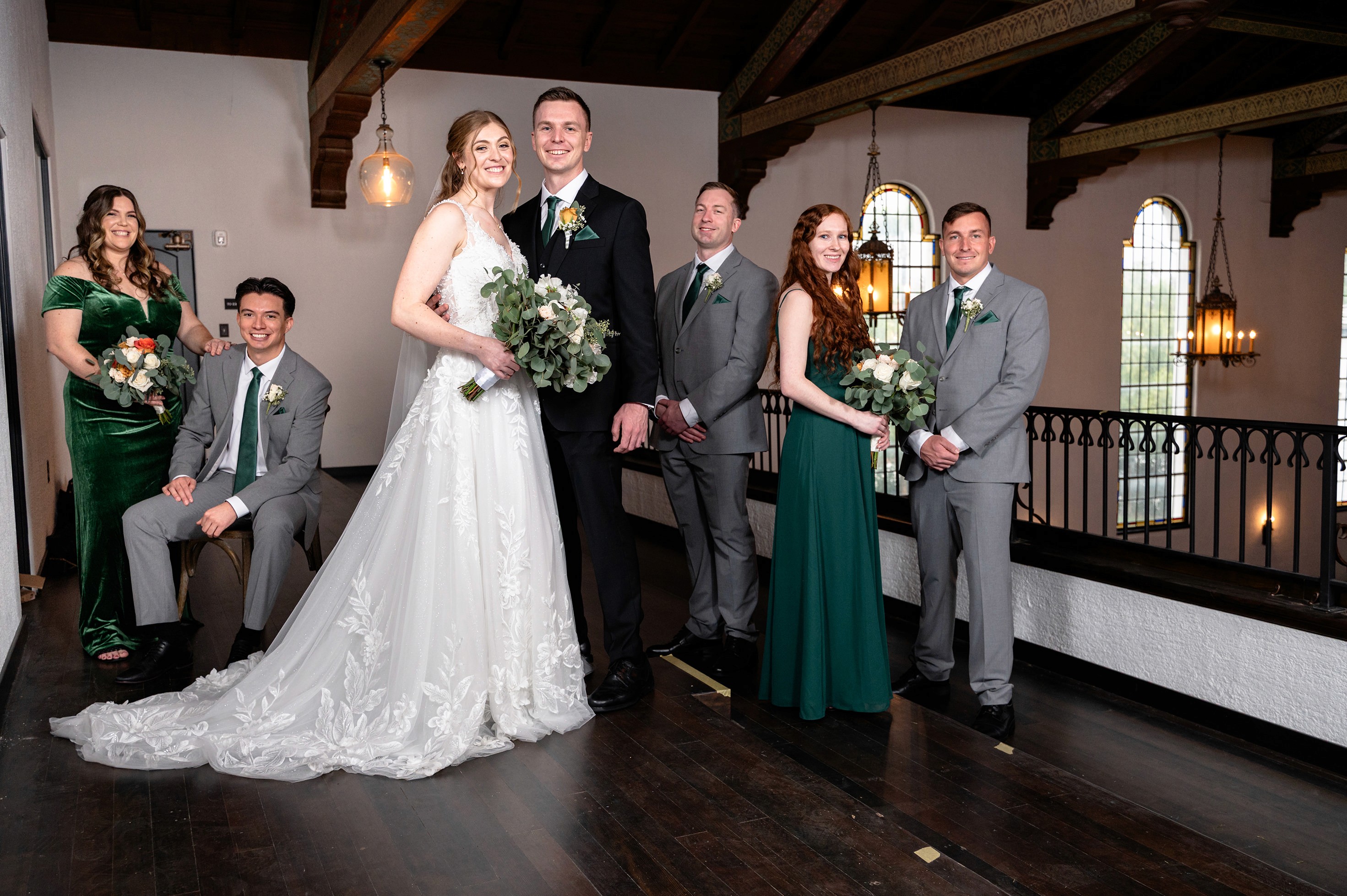 Flat lay wedding details with bouquet, rings, and sparkling bridal heels