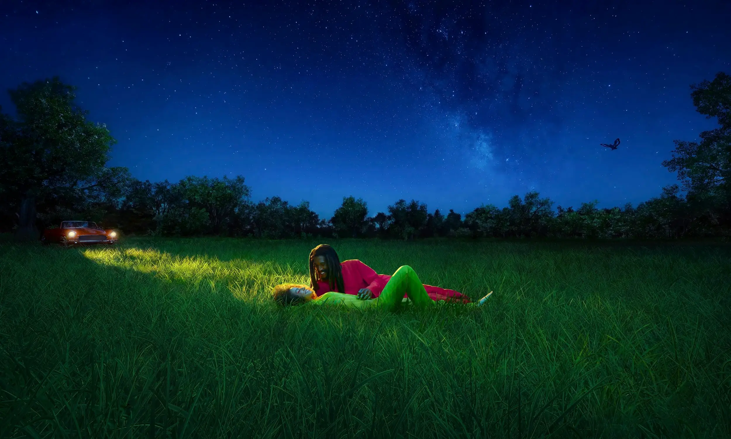 couple lying in a grass field