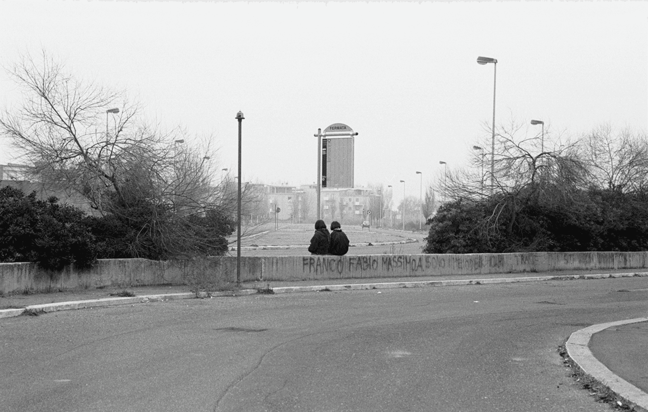 young people sat at the front of a sailboat