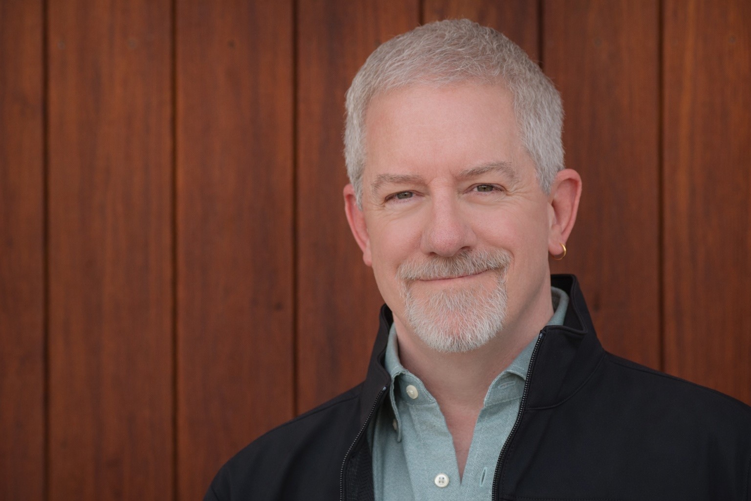 Joe Golden fiercely grabs a small desk lamp to probe its nature.