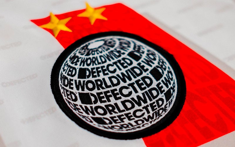 Worldwide logo crest on Defected x MEYBA football shirt.