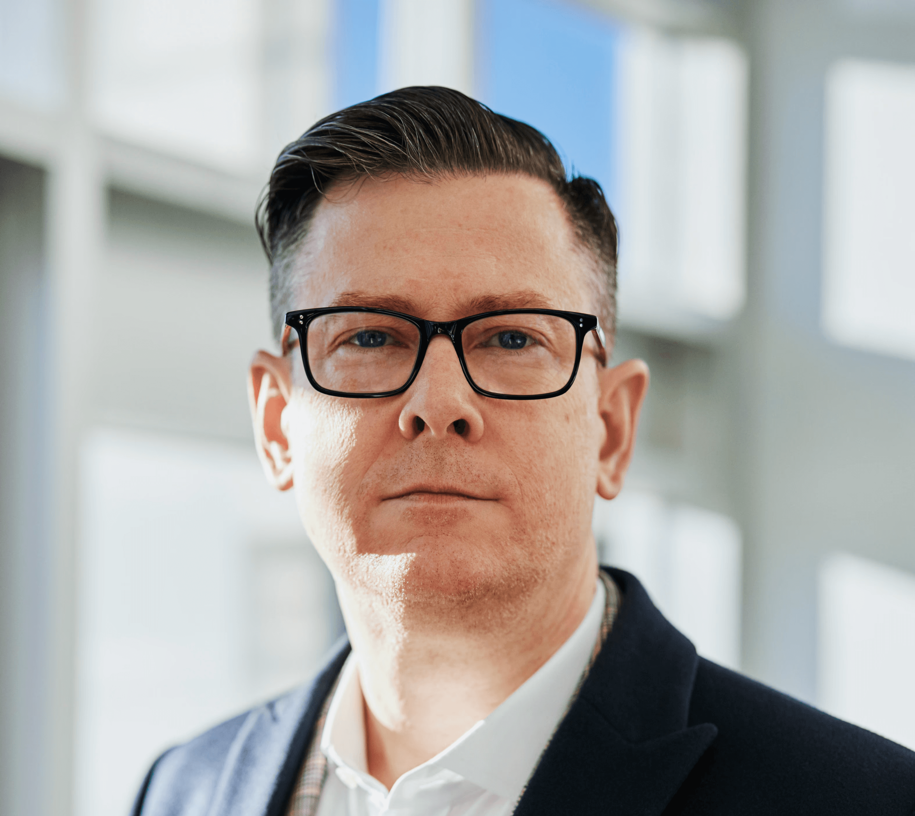 man standing beside wall