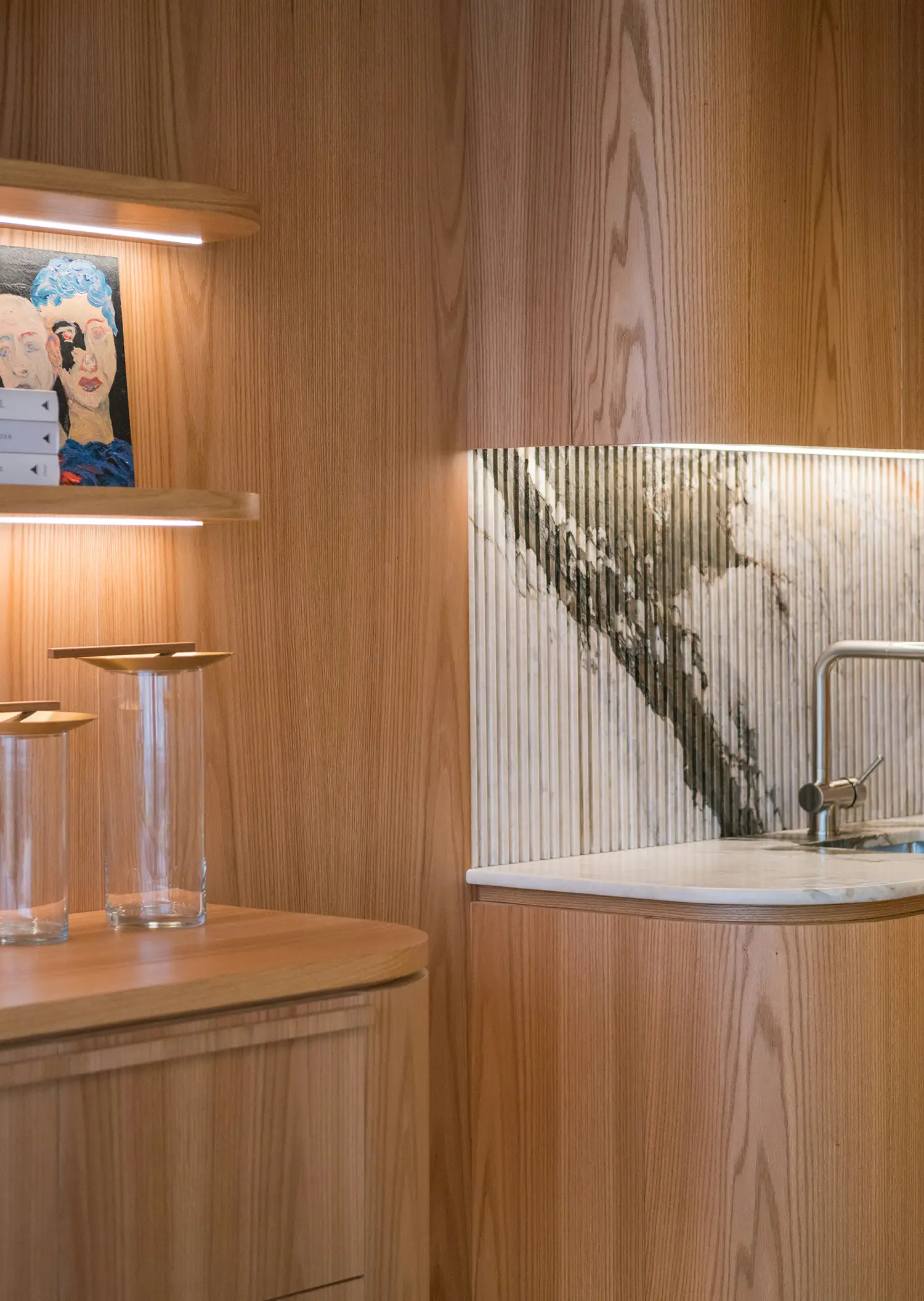 A modern kitchen and built-ins inside a luxury New York City property