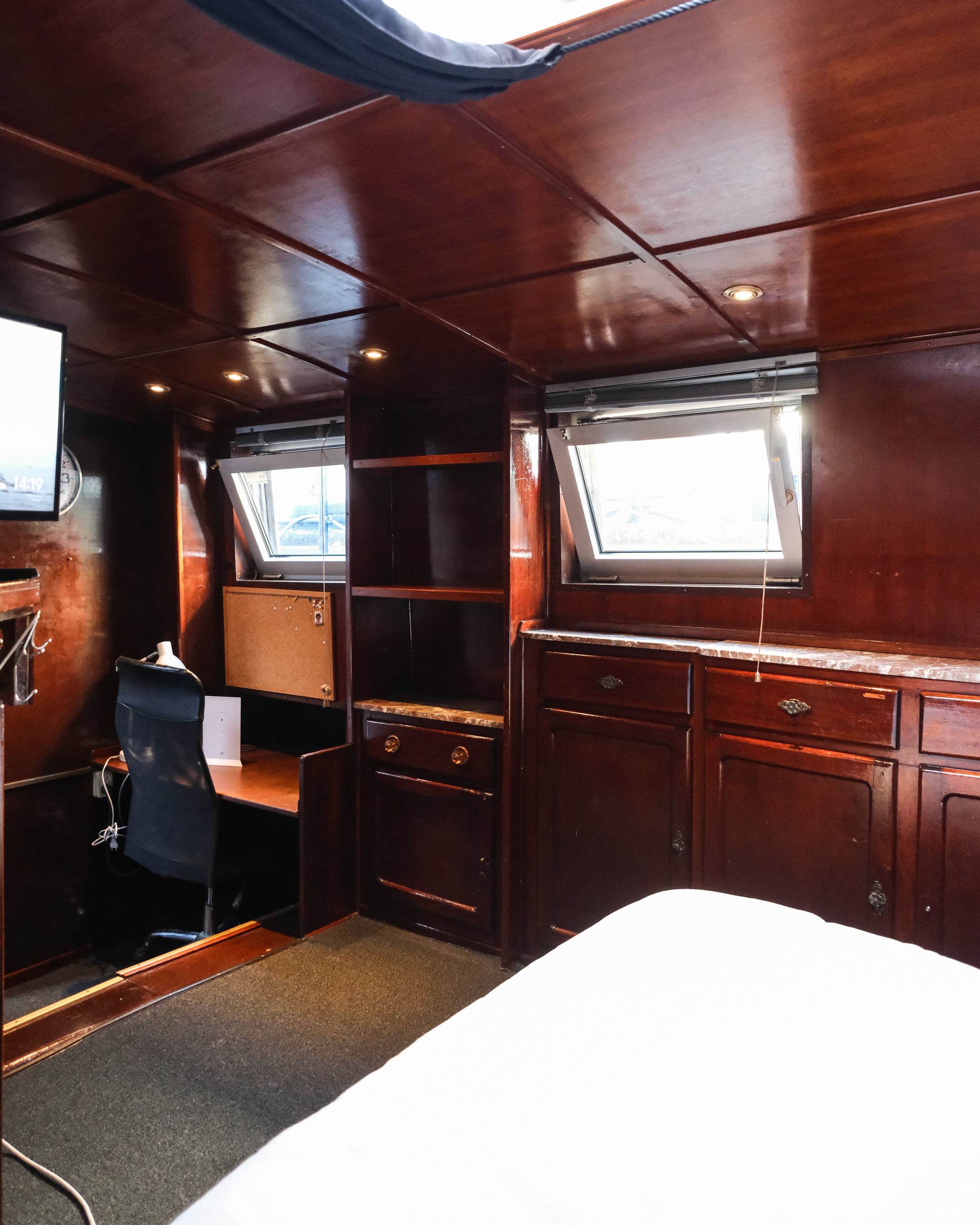 Classic bedroom with canopy bed and patterned pillows