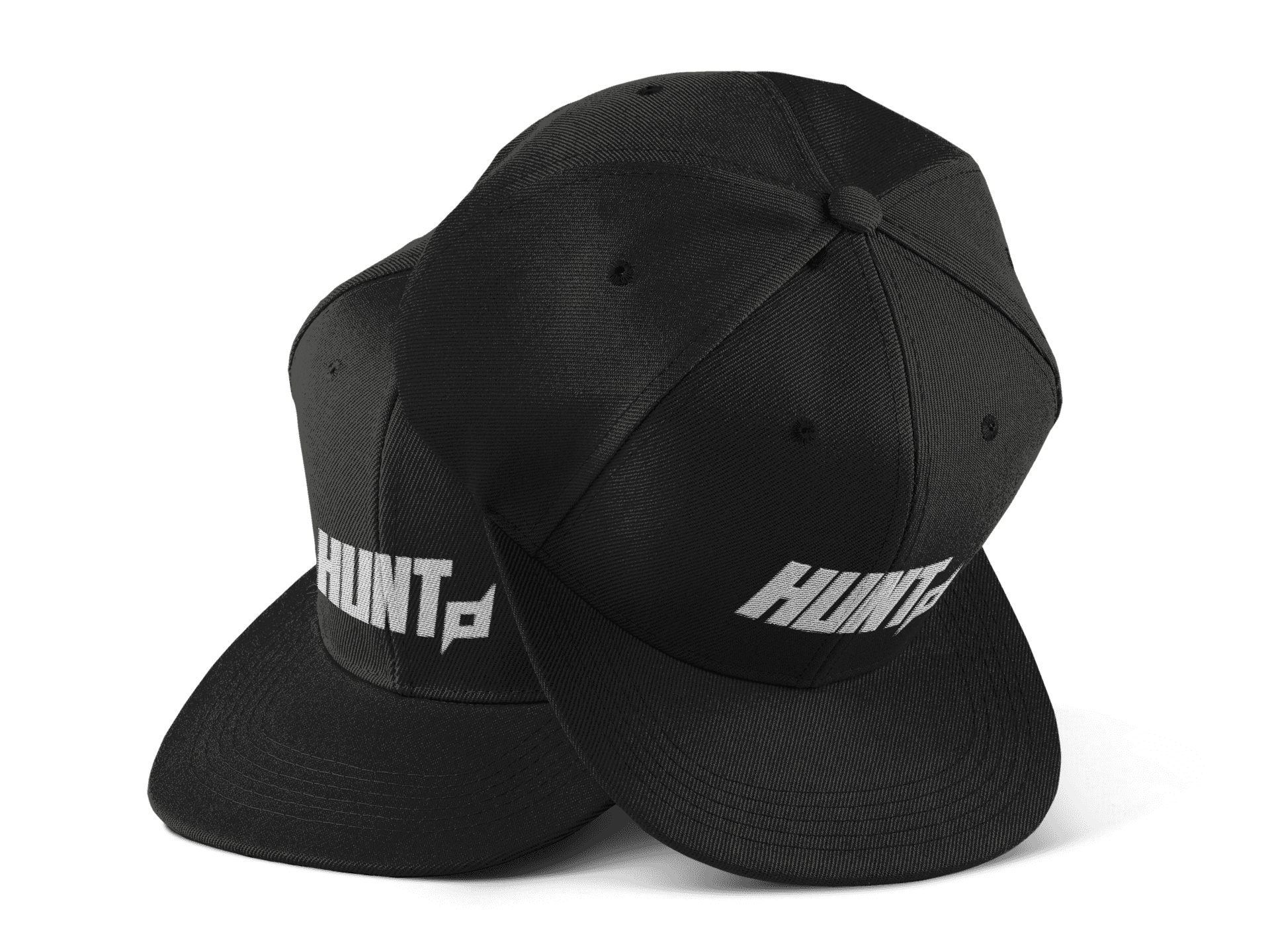 Two black snapback hats positioned side by side, each featuring the bold 'HUNT' wordmark embroidered in white on the front. The design includes a distinctive Shuriken symbol extending from the letter 'T,' adding a dynamic touch to the branding. The caps have a structured shape and flat brims, showcasing a modern and powerful look against a plain background.