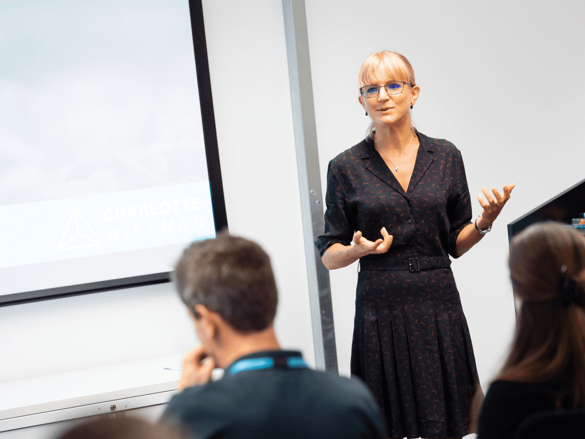 woman in white lace long sleeve shirt using silver macbook