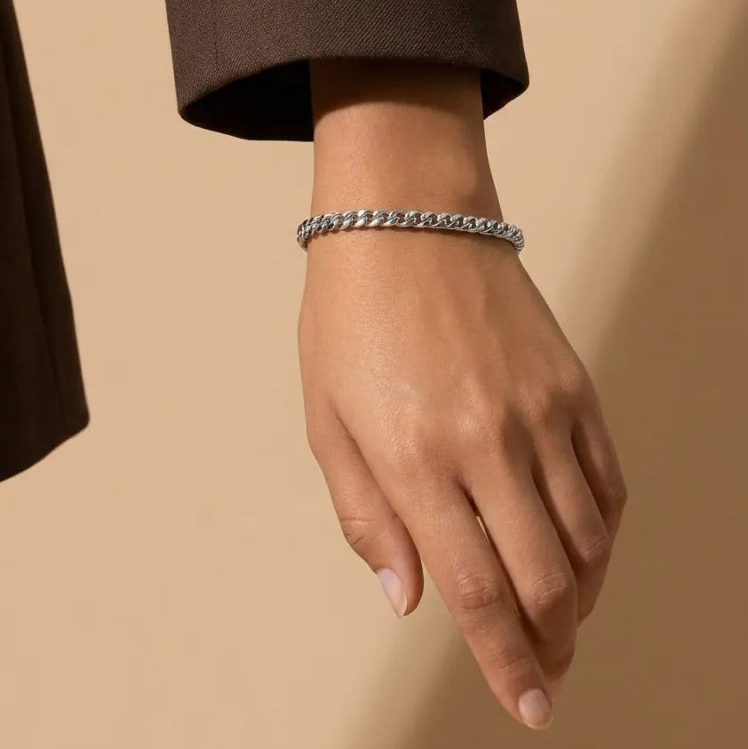 Woman's wrist wearing the Ember Link Bracelet in silver