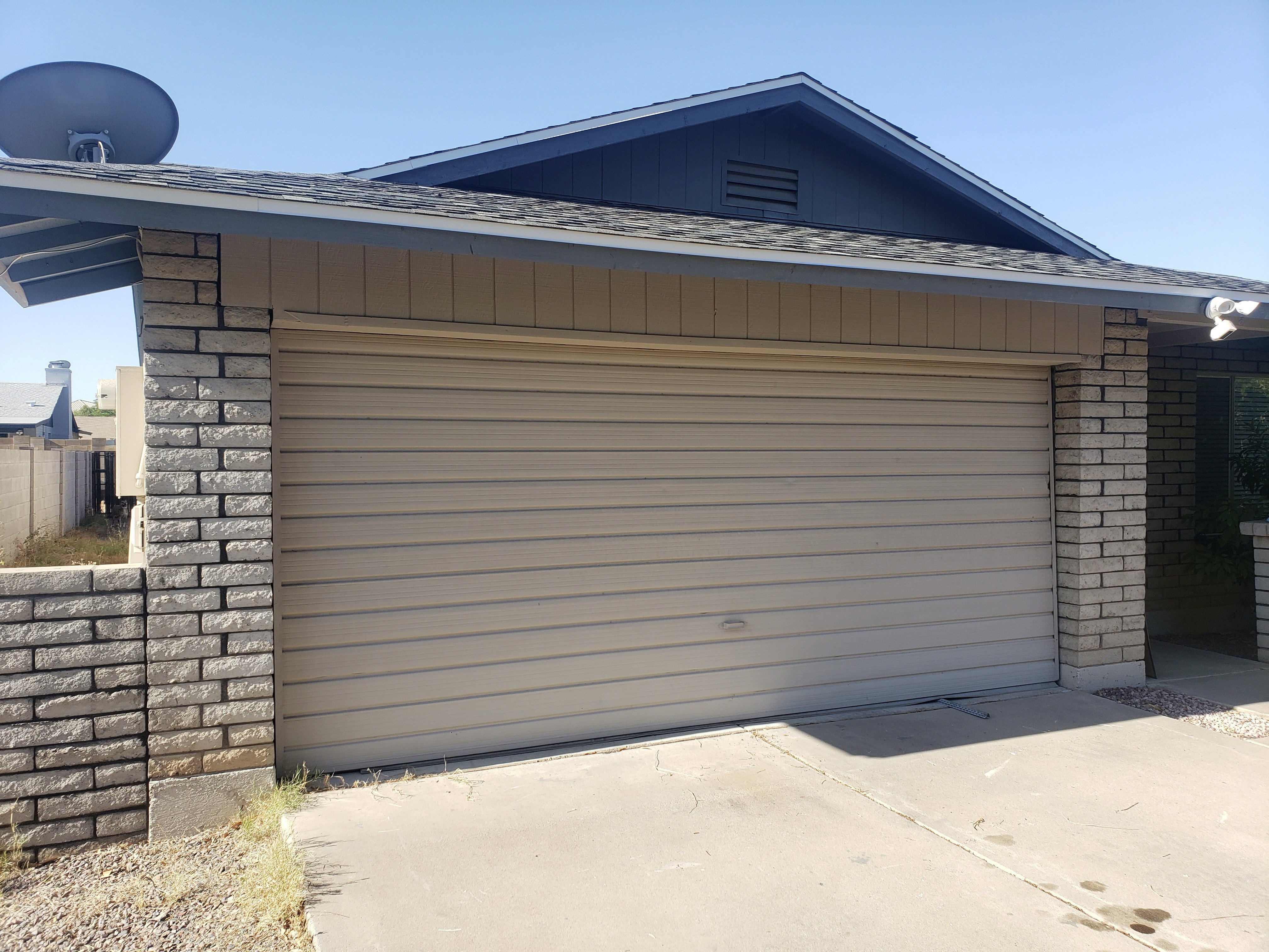 Broken garage door before replacement