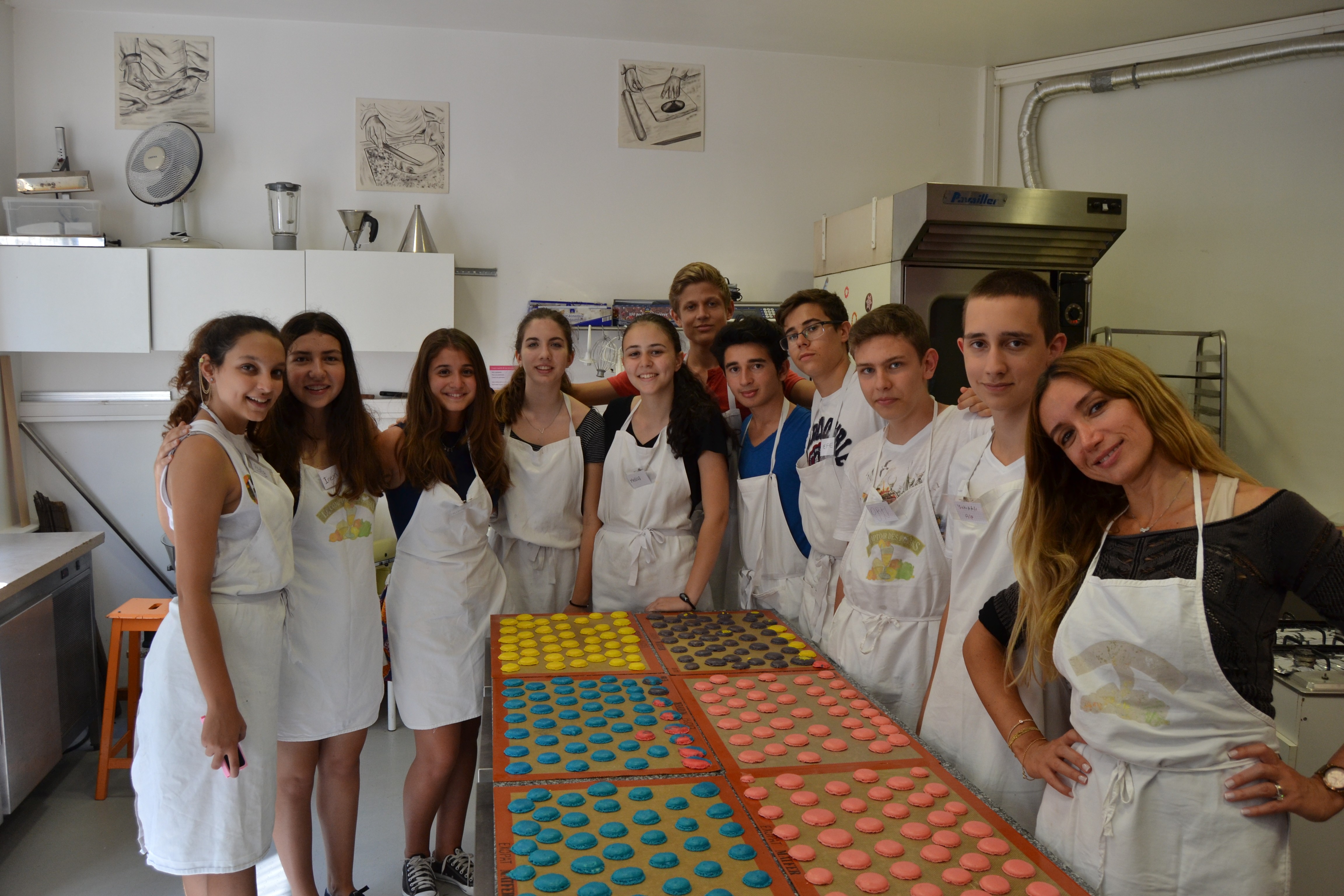 Family riding in a utility vehicle through a field.