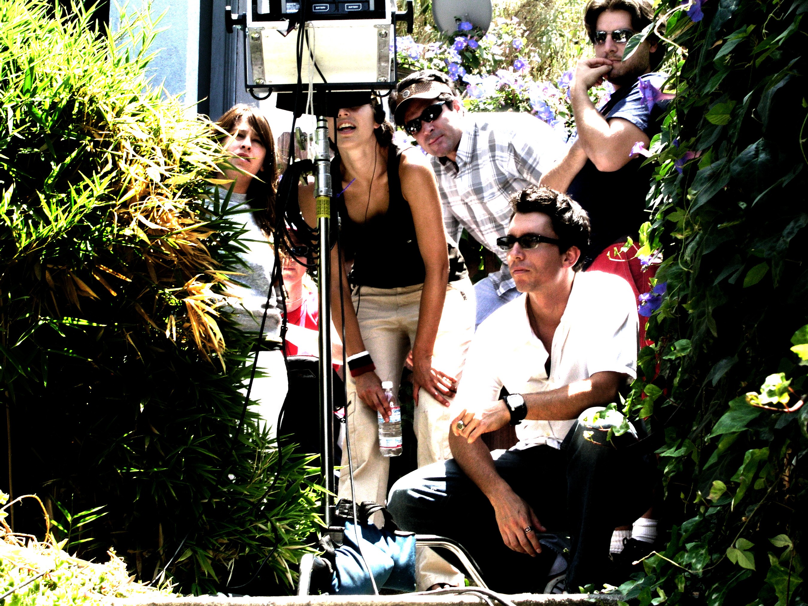 Group of people in "video village" on a film set.