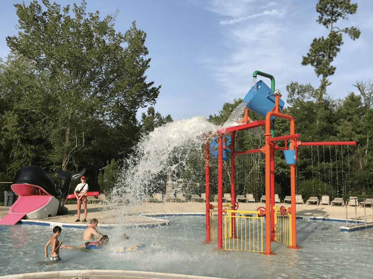 woodlands pool with bucket and lifeguard