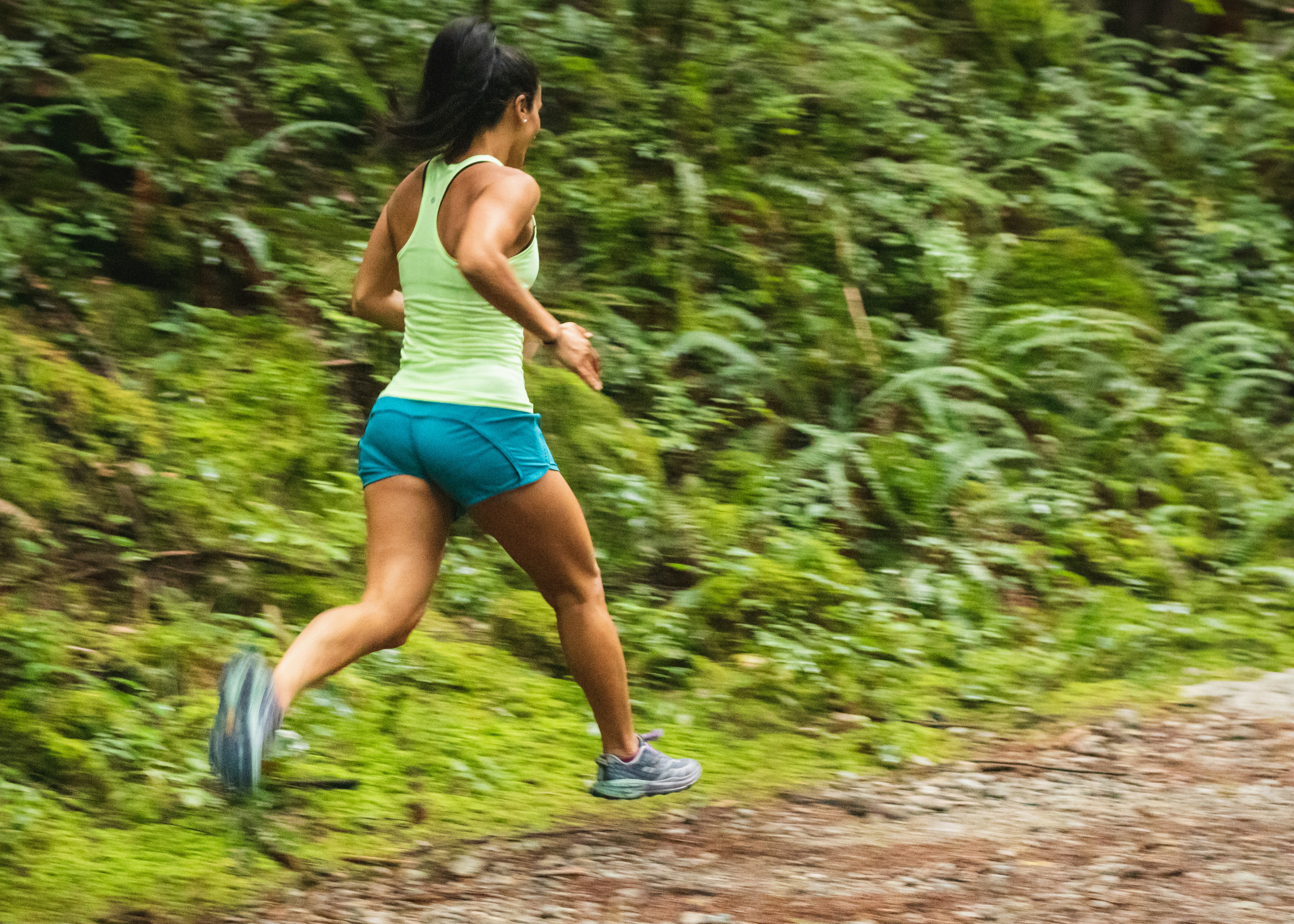 Woman Running Through Forest