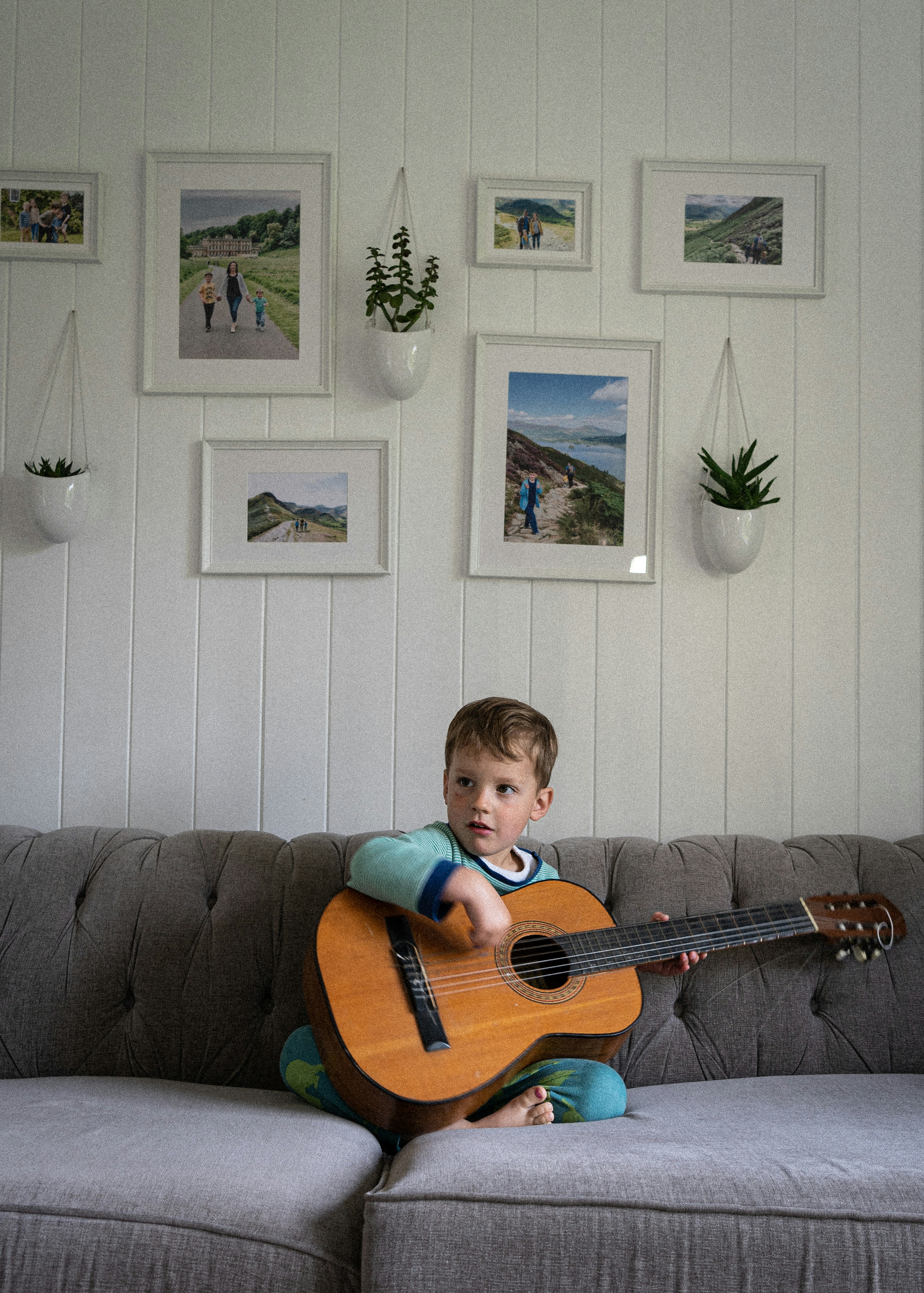 baby playing guitar