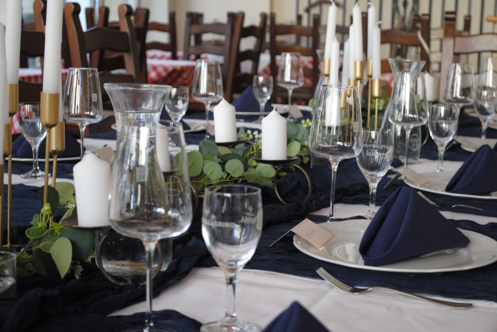 an interior of a fine dining restaurant with focused shot on the table with the plates and glass has been served