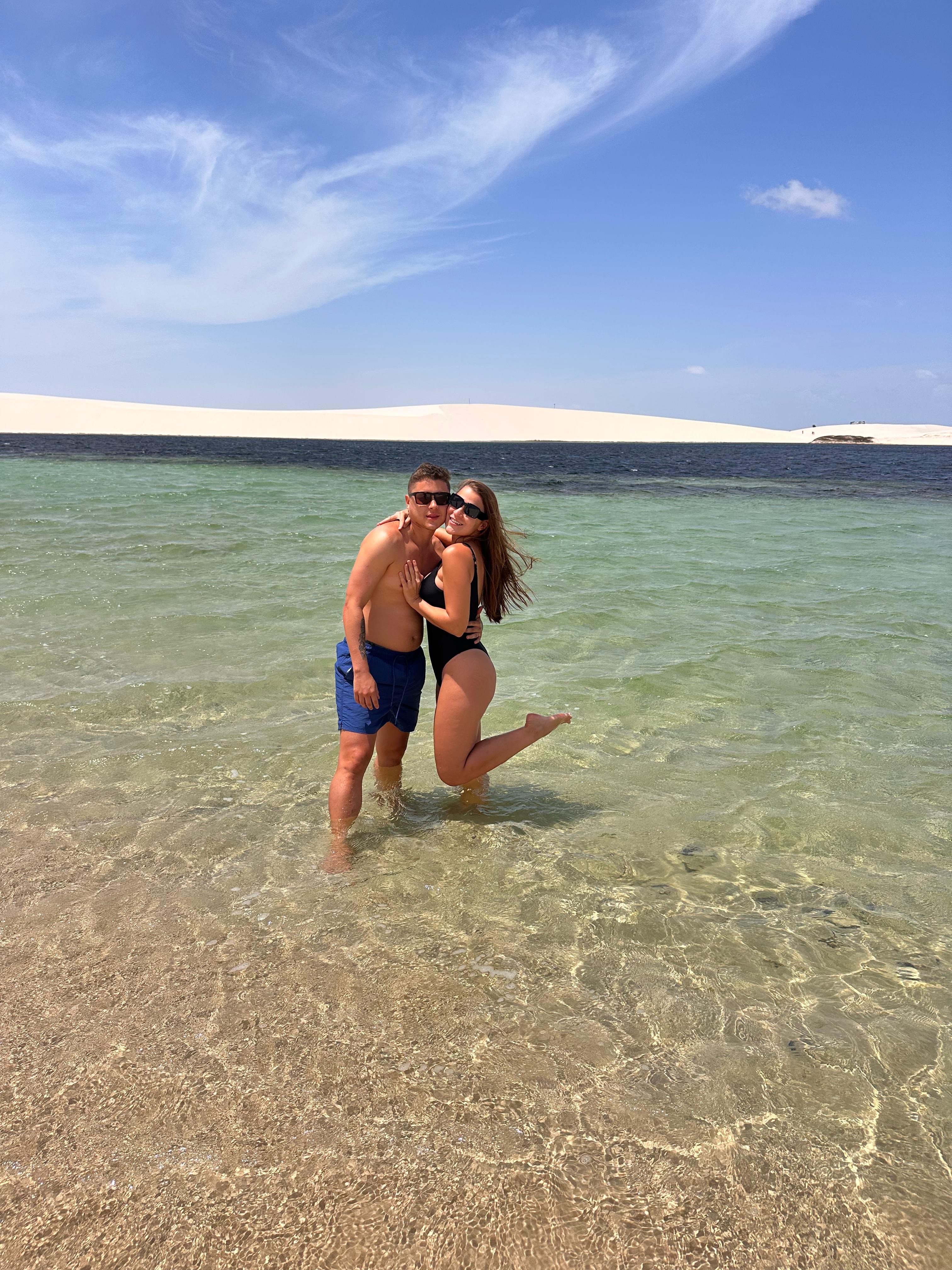 Woman logistics manager using a tablet in a busy warehouse.