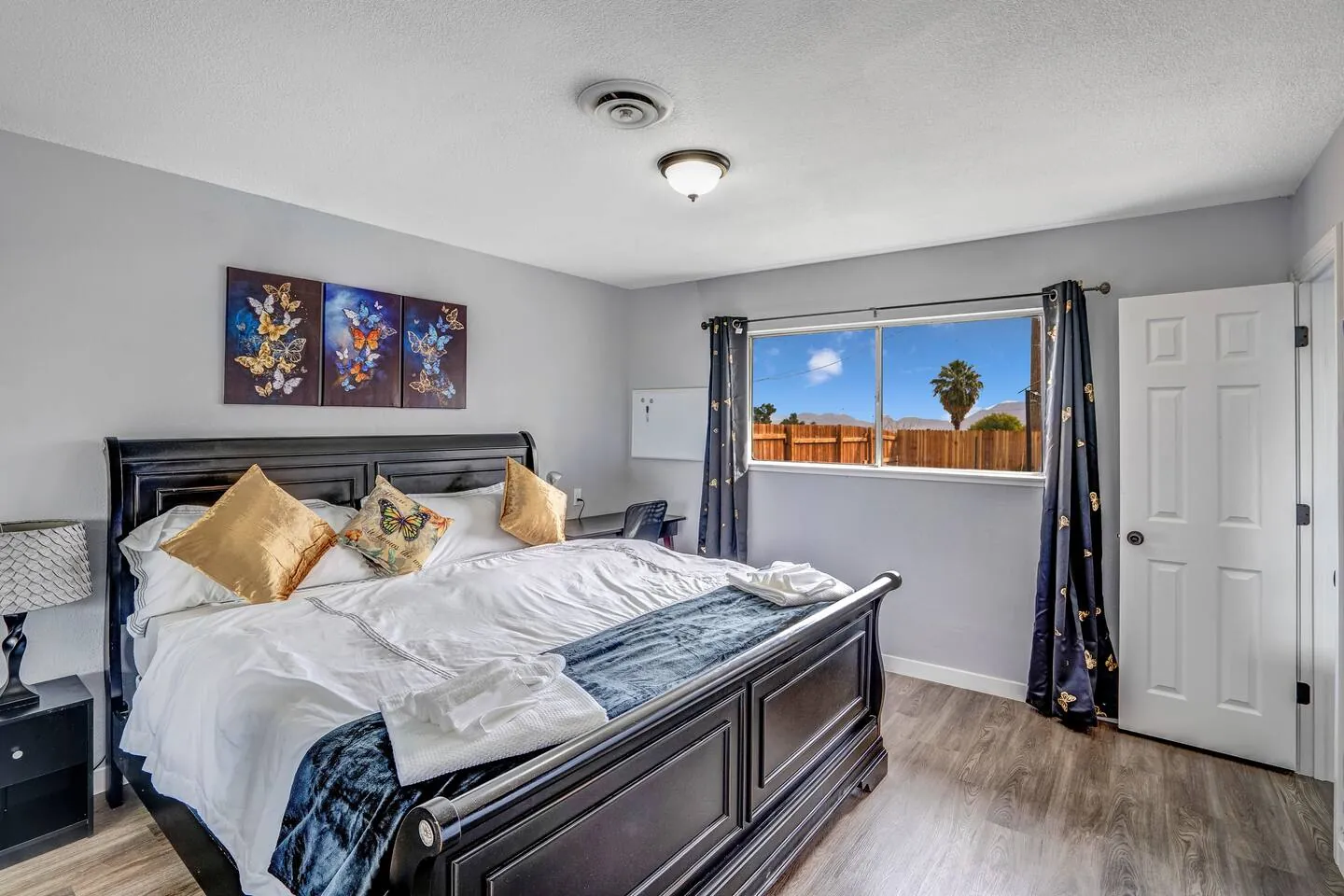 King bedroom with a work desk and TV, Big Groups Retreat in North Las Vegas