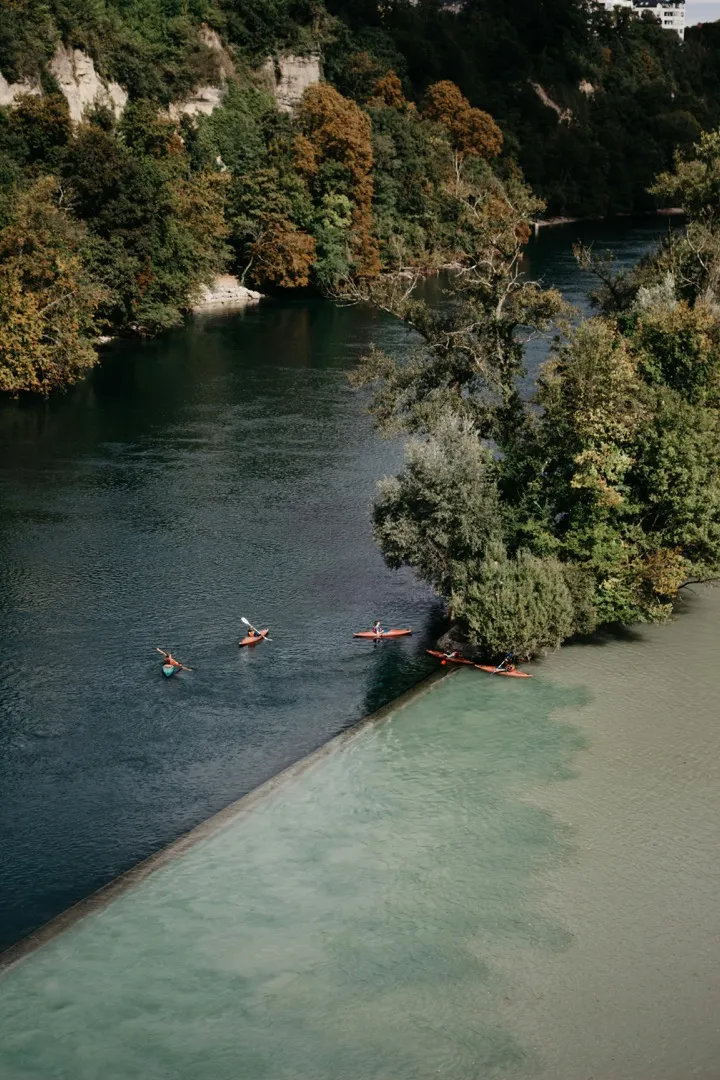 Two people in separate kayaks explore a rocky ravine
