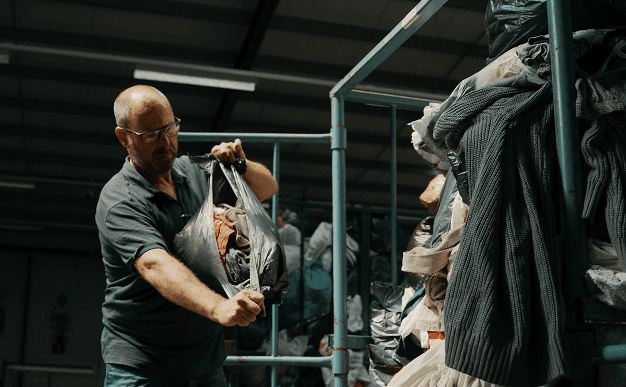 person holding white labeled bottle